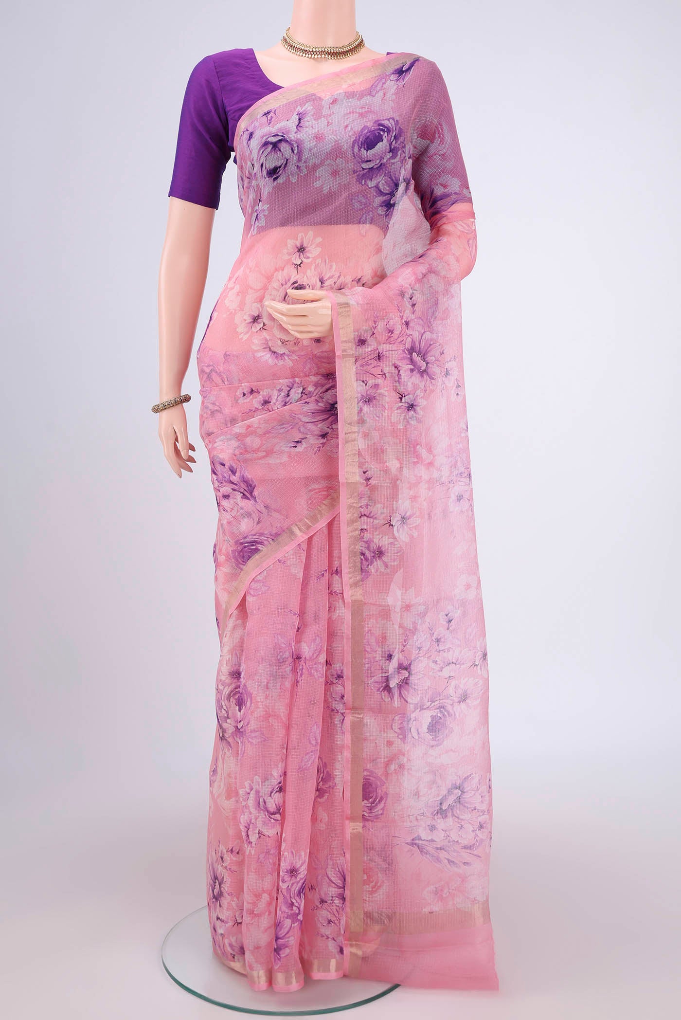 Rose pink Kota Silk Saree with Floral Print on the body and Zari Border.  displayed on a mannequin