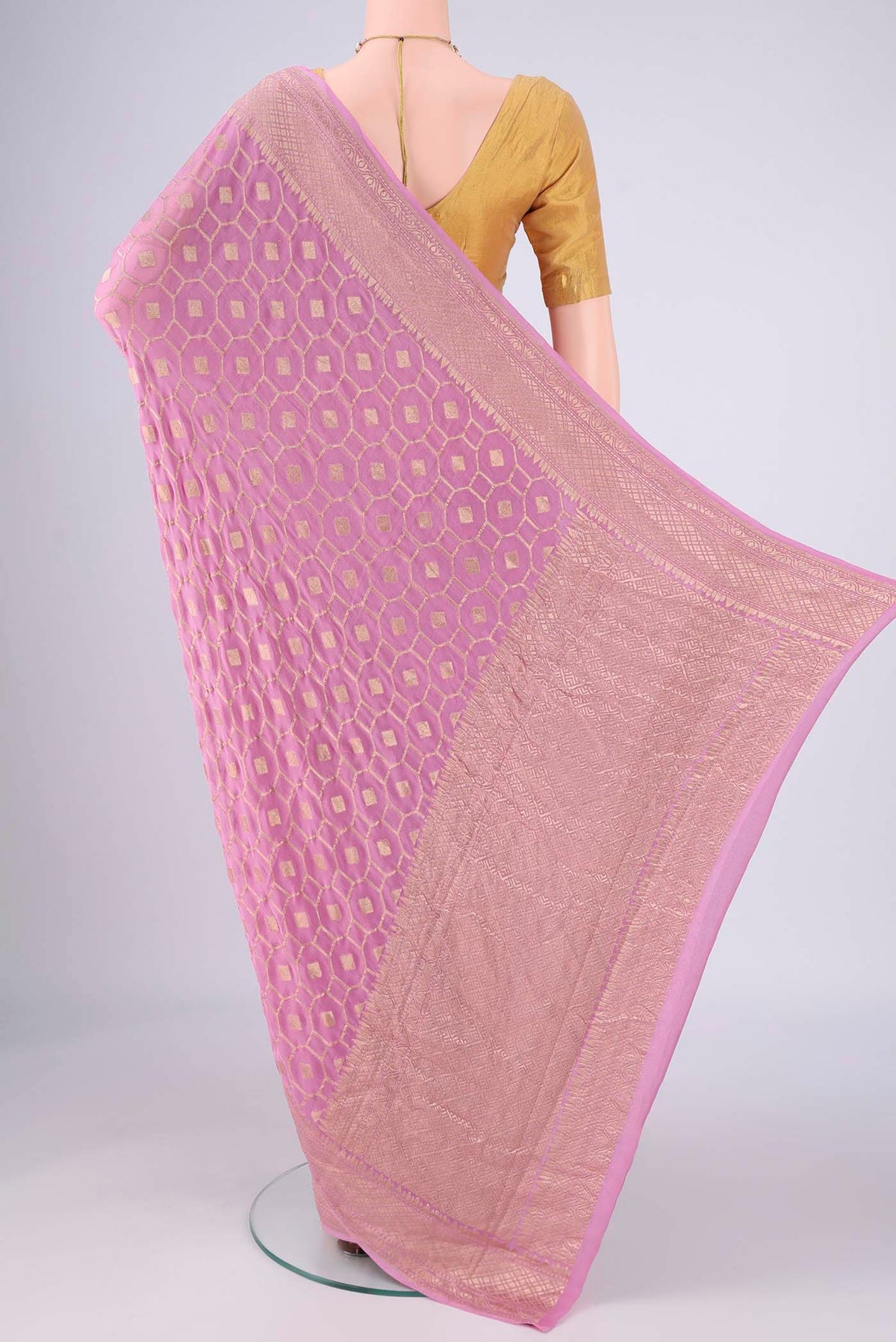 Flat view of Lilac Banarasi Georgette Saree with Zari Brocade on the body and Zari Border. 