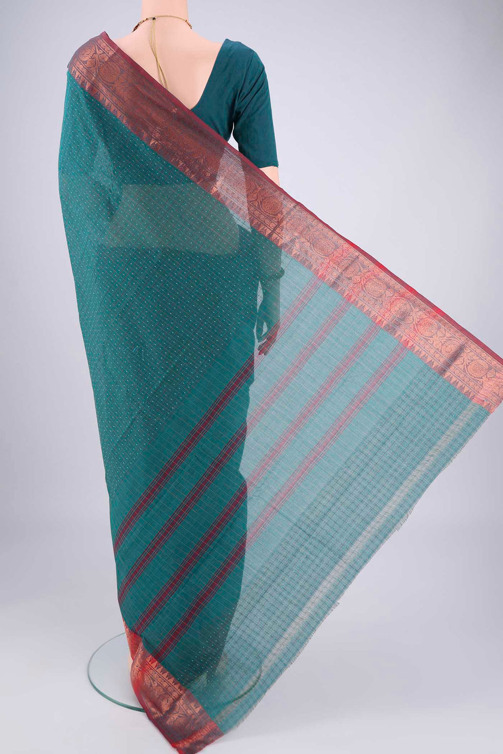 Flat view of Green Kanchi Cotton Saree with Checked design on the body and Zari Border. 