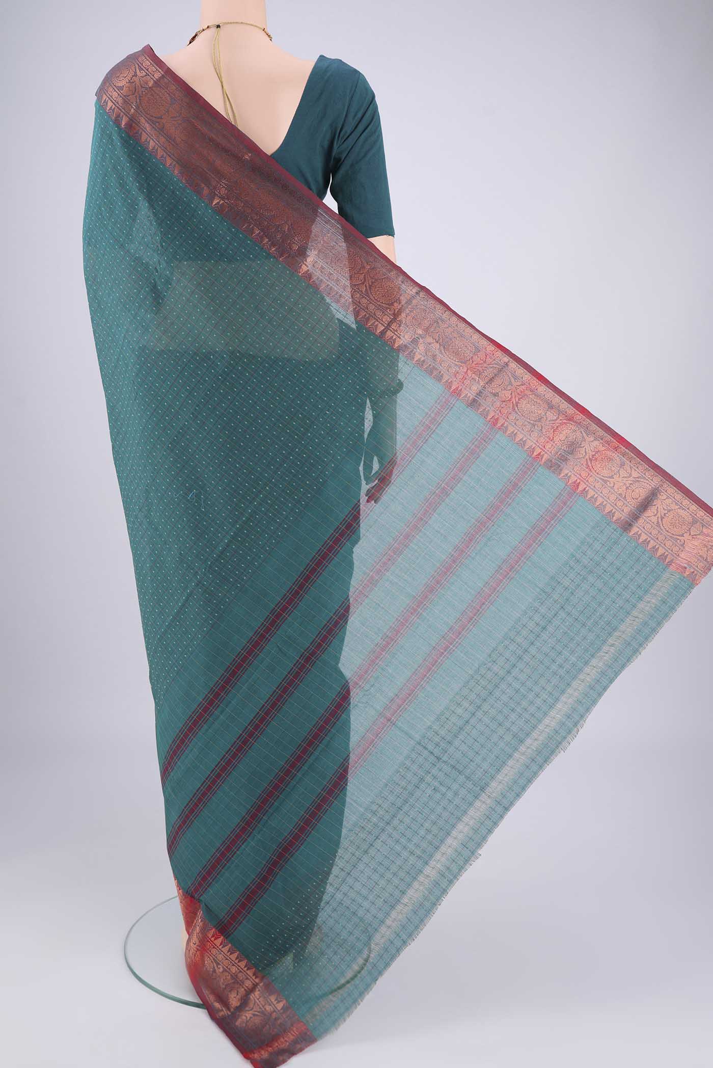 Flat view of Green Kanchi Cotton Saree with Checked design on the body and Zari Border. 