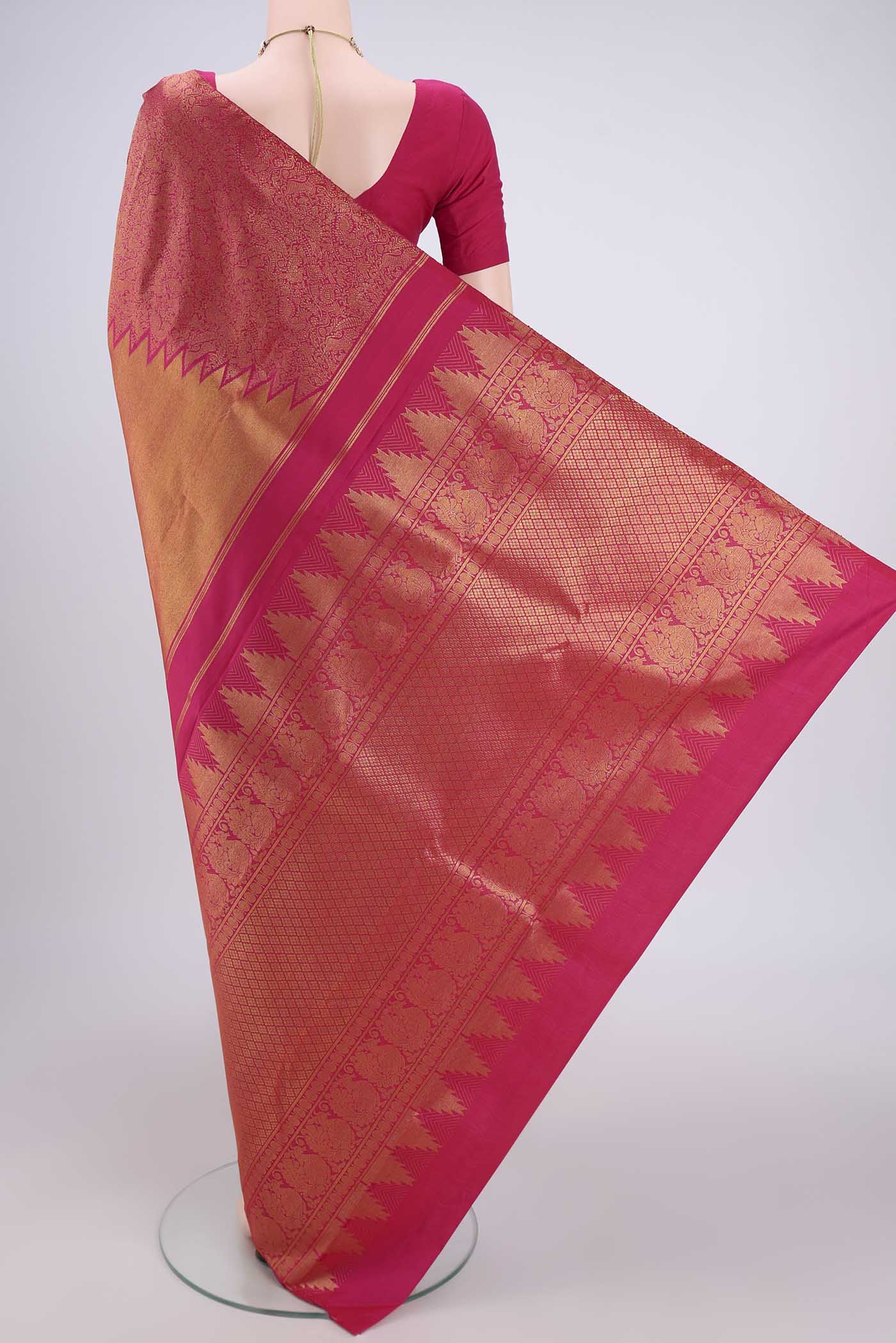 Flat view of Rani Pink Dual Tone Kanchipuram Silk Saree with Half And Half on the body and Temple Border. 