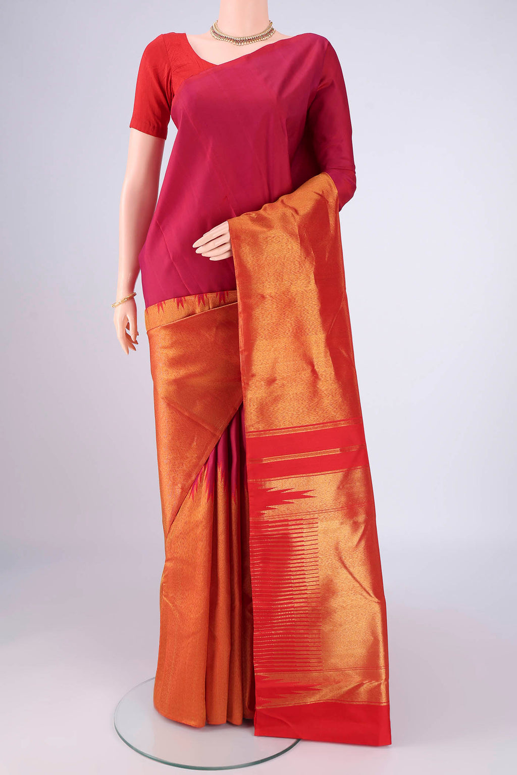 Multi Color Kanjivaram Silk Saree with Plain Body and Rising Temple Border.  displayed on a mannequin