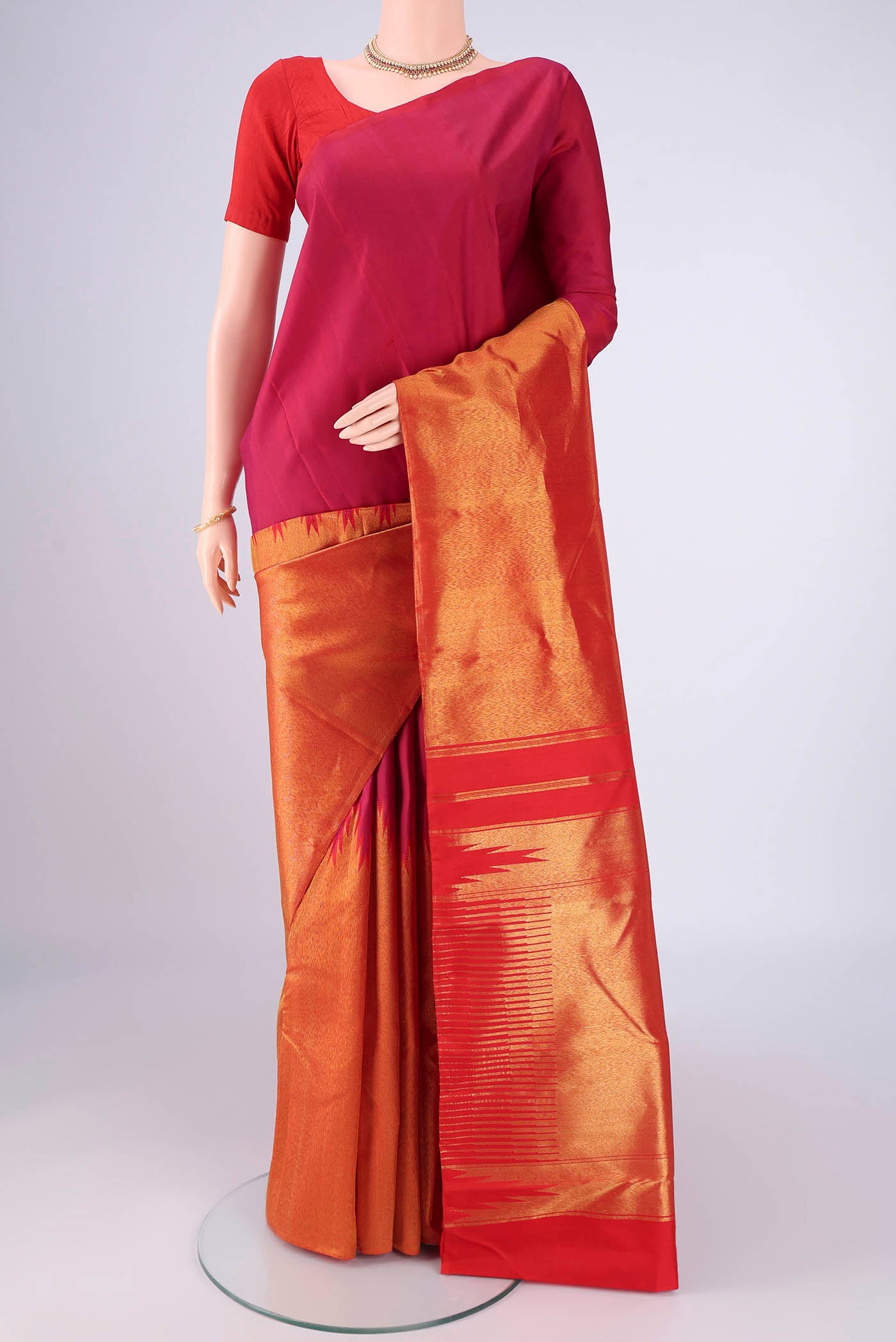 Multi Color Kanjivaram Silk Saree with Plain Body and Rising Temple Border.  displayed on a mannequin