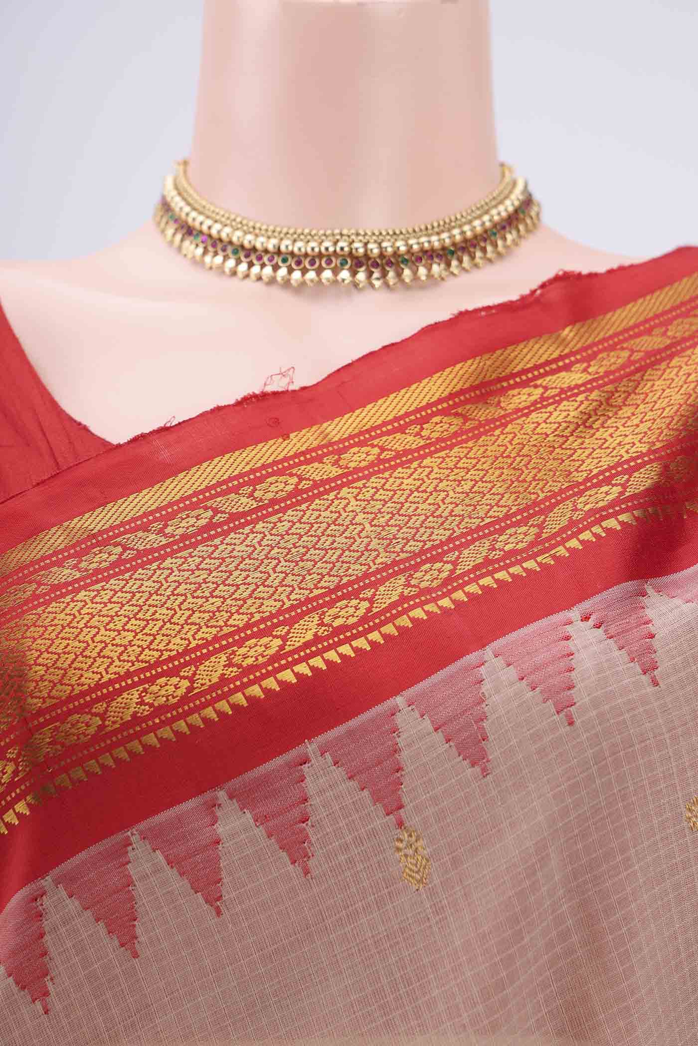 Border image of Beige Gadwal Silk Saree with Zari Butta on the body and Zari Border. 