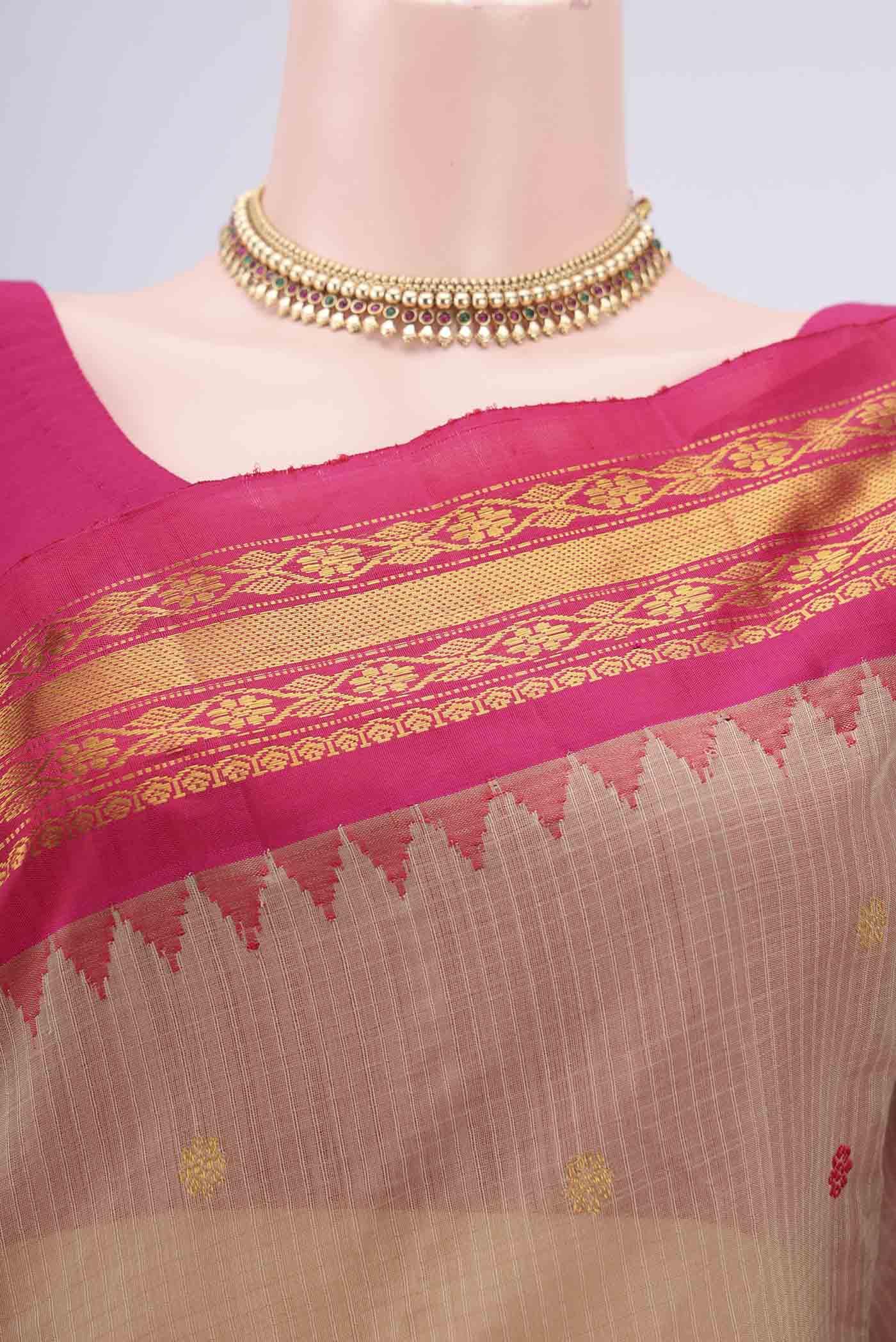 Border image of Beige Gadwal Silk Saree with Zari And Thread Butta on the body and Zari Border. 