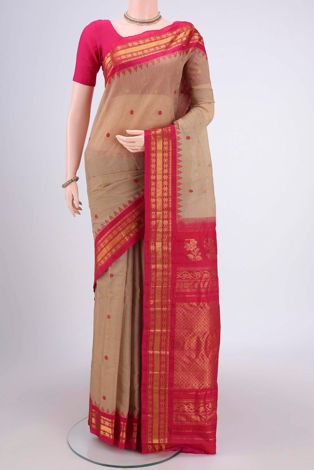 Beige Gadwal Silk Saree with Zari And Thread Butta on the body and Zari Border.  displayed on a mannequin