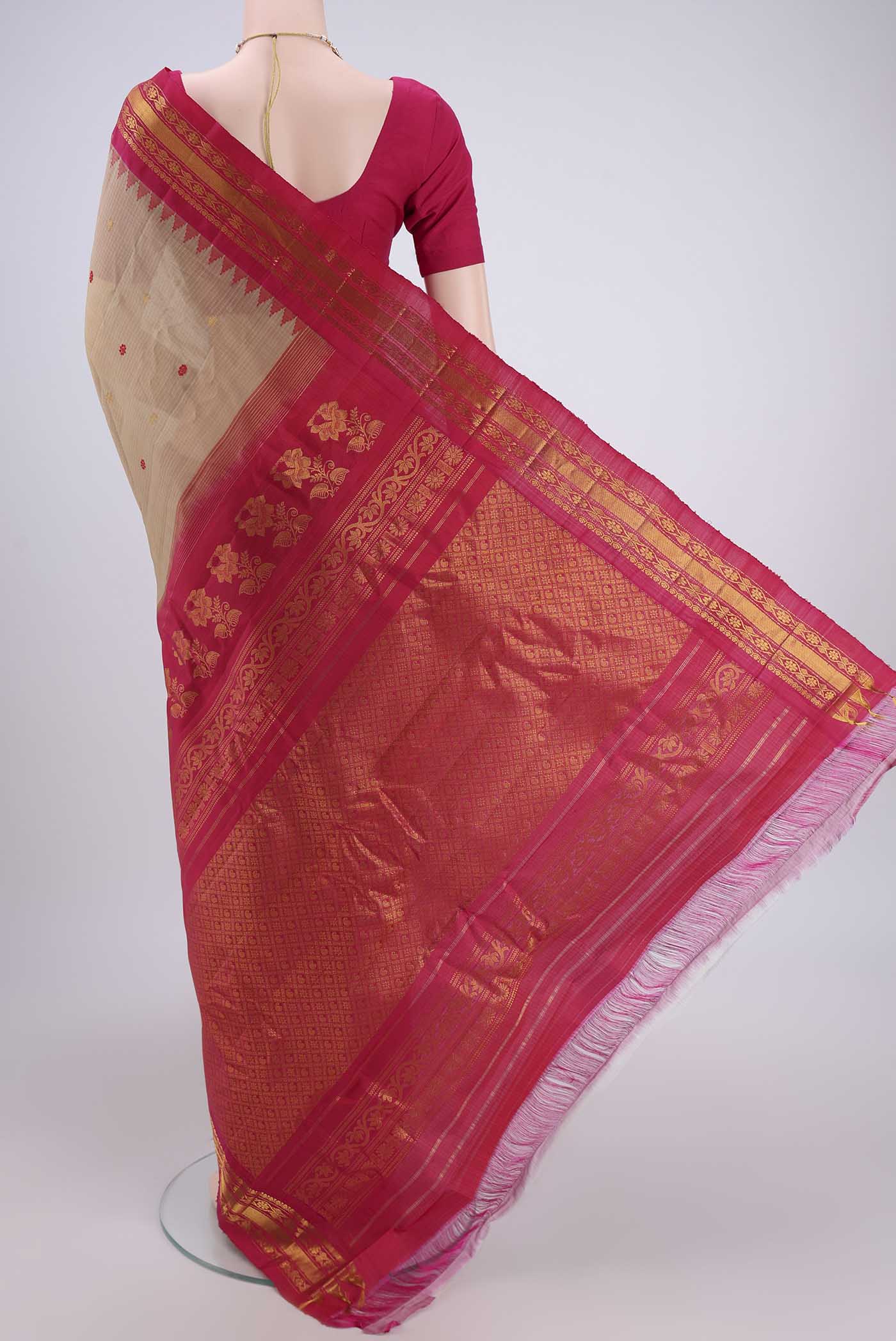 Flat view of Beige Gadwal Silk Saree with Zari And Thread Butta on the body and Zari Border. 