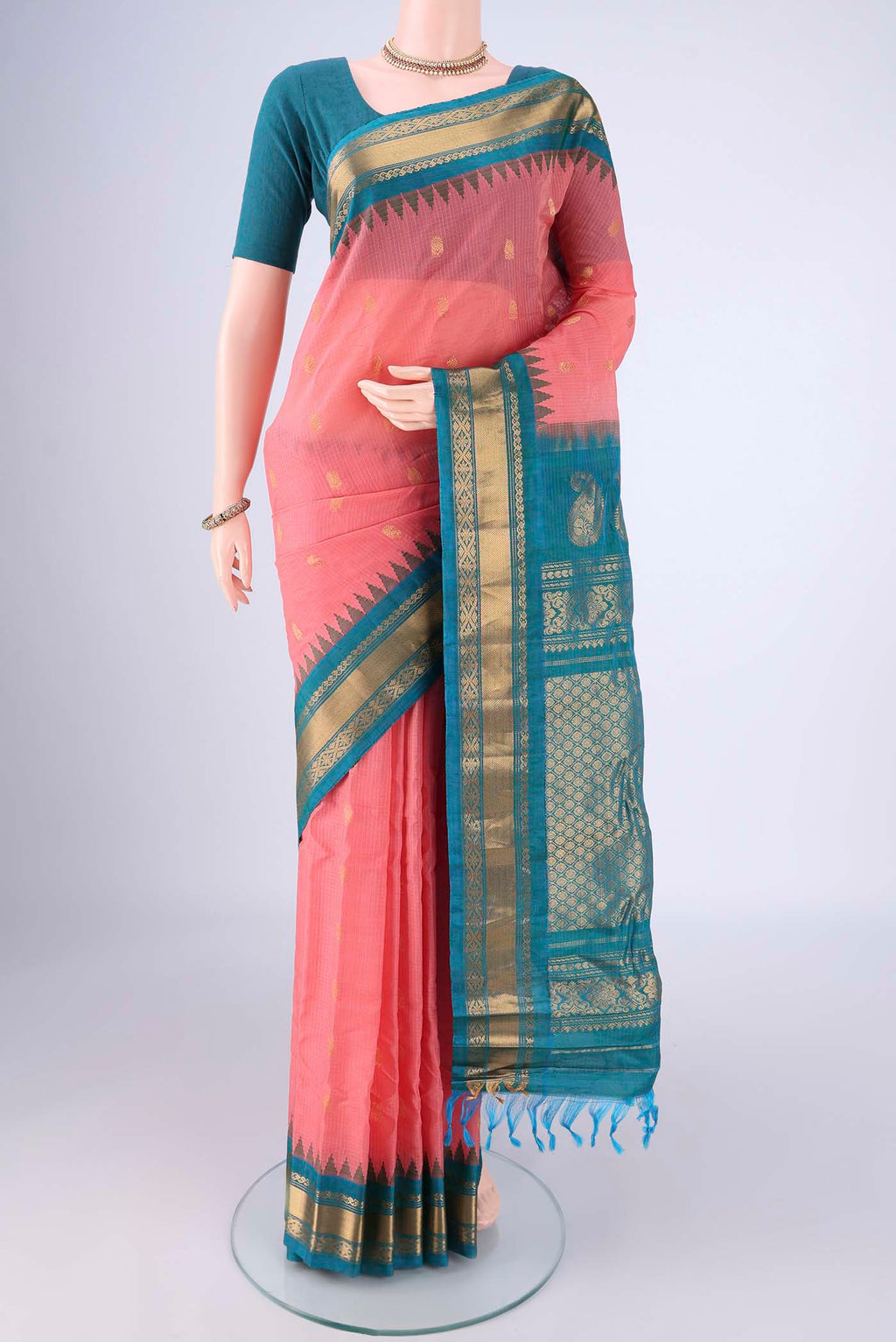 Coral Gadwal Silk Cotton Saree with Zari Butta on the body and Silk Border.  displayed on a mannequin