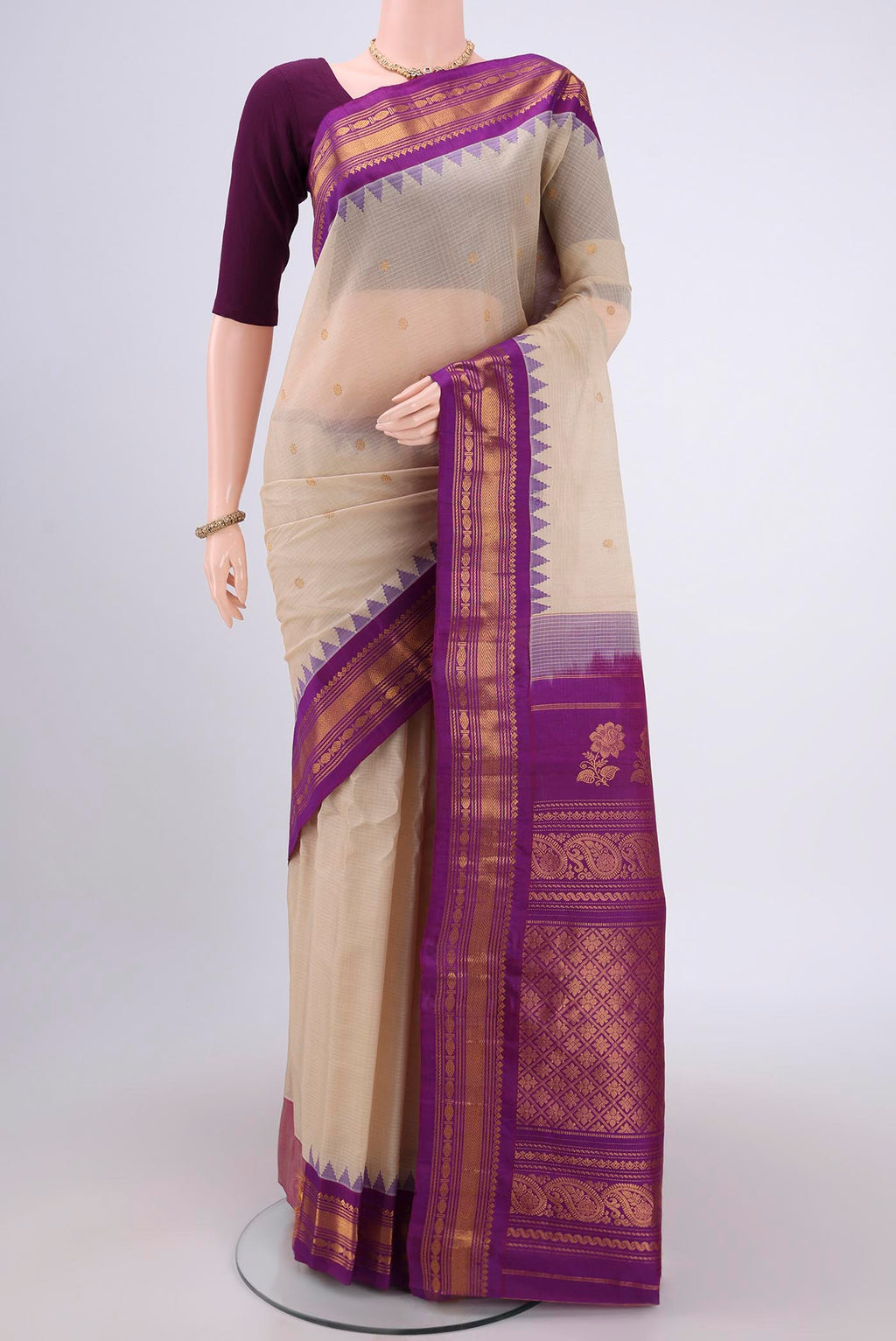 Beige Gadwal Silk Saree with Zari Butta on the body and Zari Border.  displayed on a mannequin