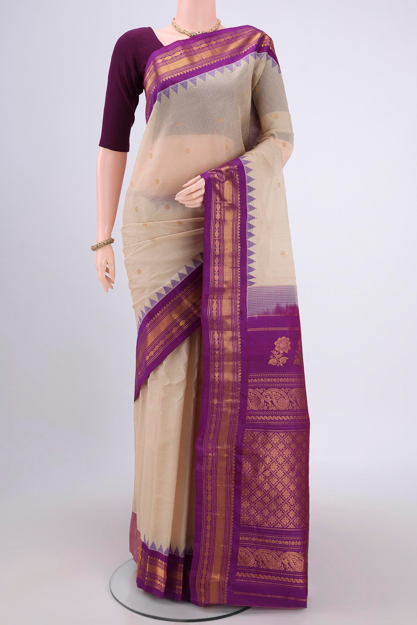 Beige Gadwal Silk Saree with Zari Butta on the body and Zari Border.  displayed on a mannequin