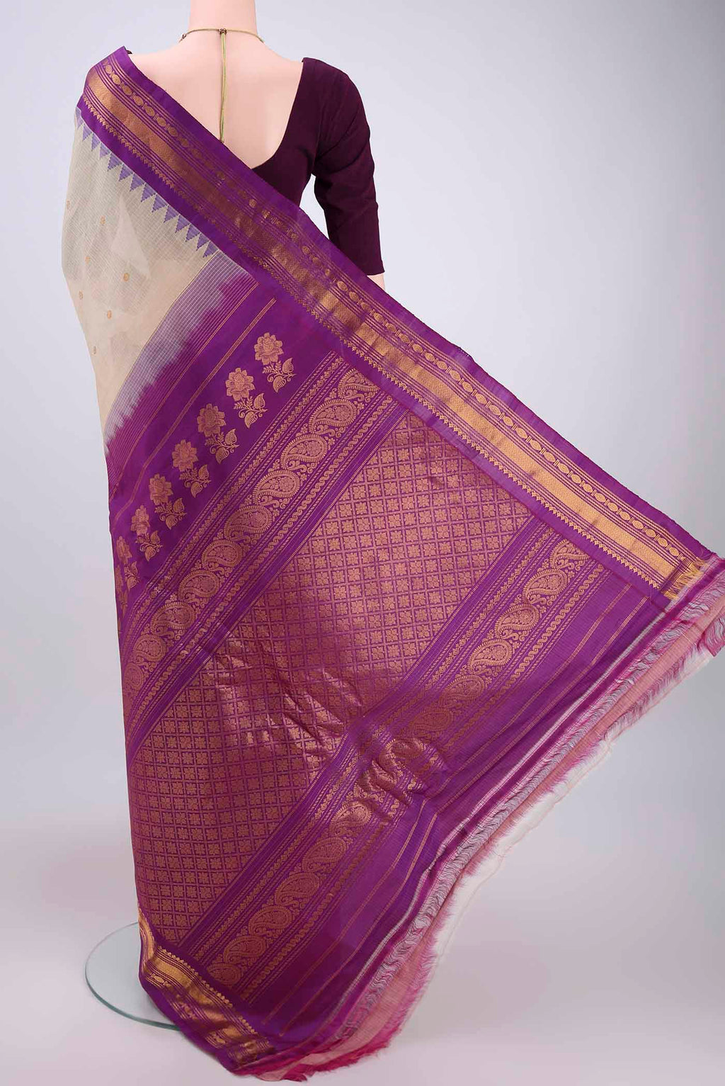 Flat view of Beige Gadwal Silk Saree with Zari Butta on the body and Zari Border. 