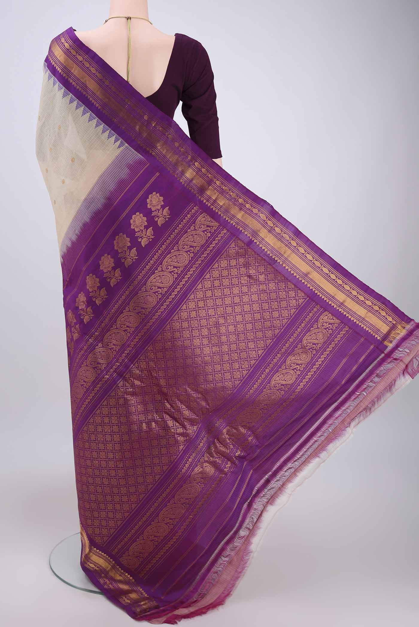 Flat view of Beige Gadwal Silk Saree with Zari Butta on the body and Zari Border. 