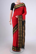 Red Gadwal Silk Saree with Zari Butta on the body and Zari Border.  displayed on a mannequin