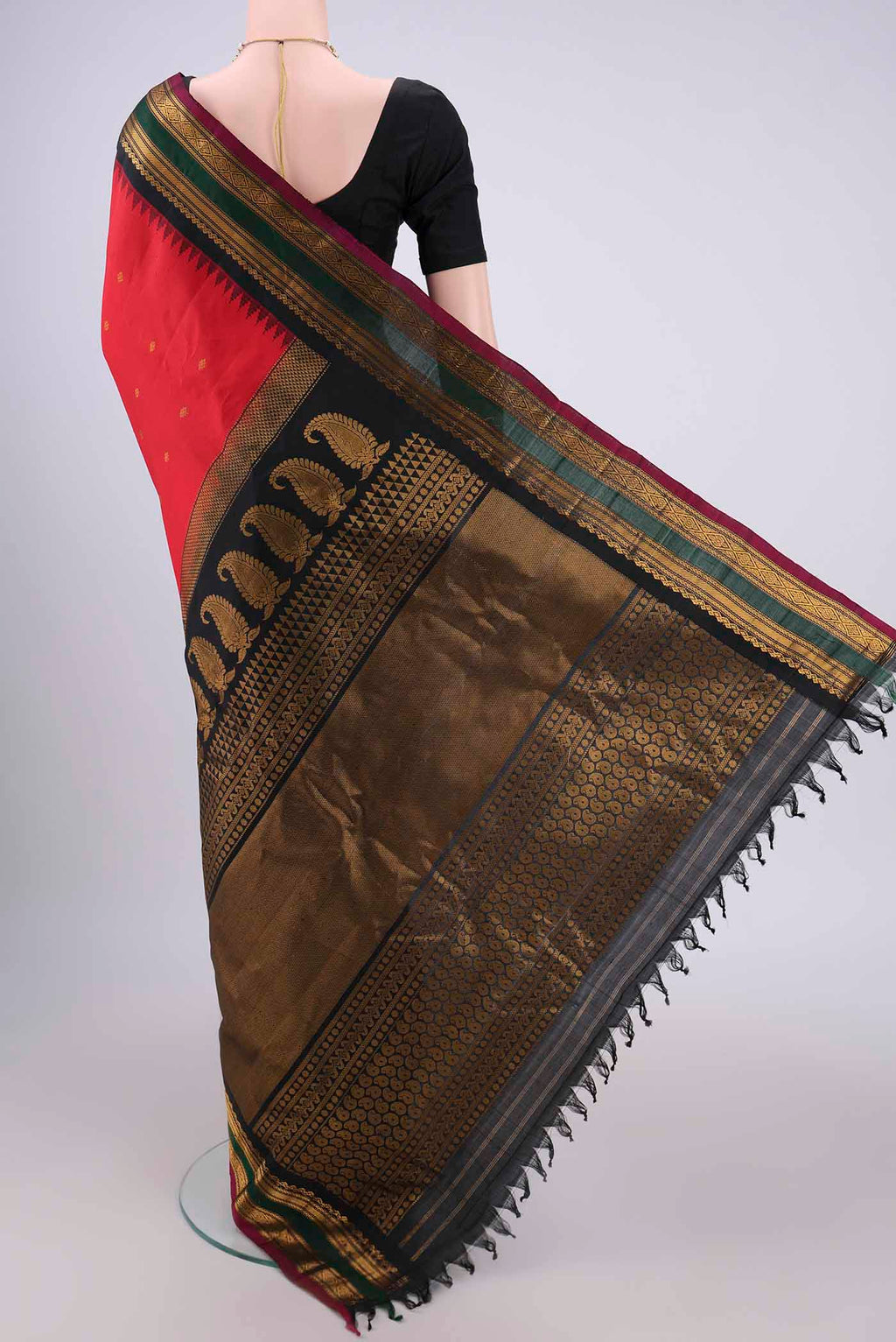 Flat view of Red Gadwal Silk Saree with Zari Butta on the body and Zari Border. 