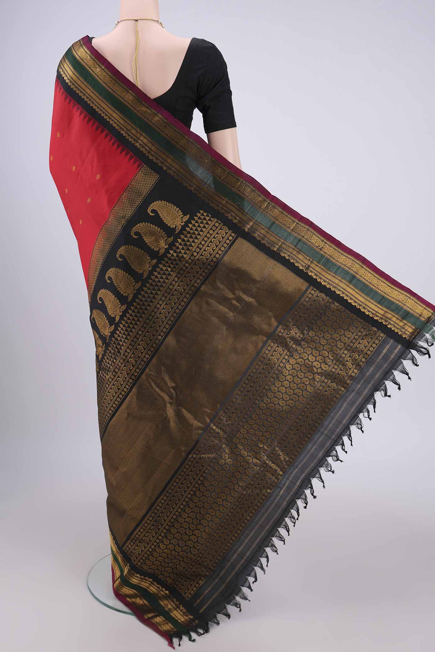 Flat view of Red Gadwal Silk Saree with Zari Butta on the body and Zari Border. 
