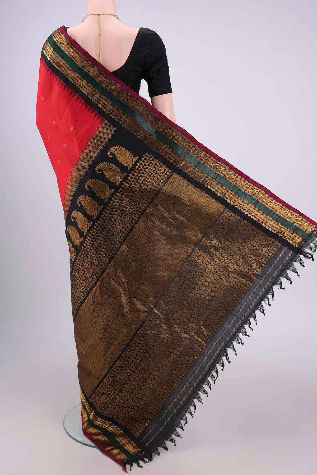 Flat view of Red Gadwal Silk Saree with Zari Butta on the body and Zari Border. 