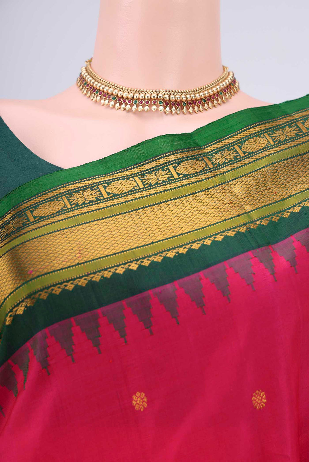 Border image of Rani Pink Gadwal Silk Saree with Zari Butta on the body and Zari Border. 