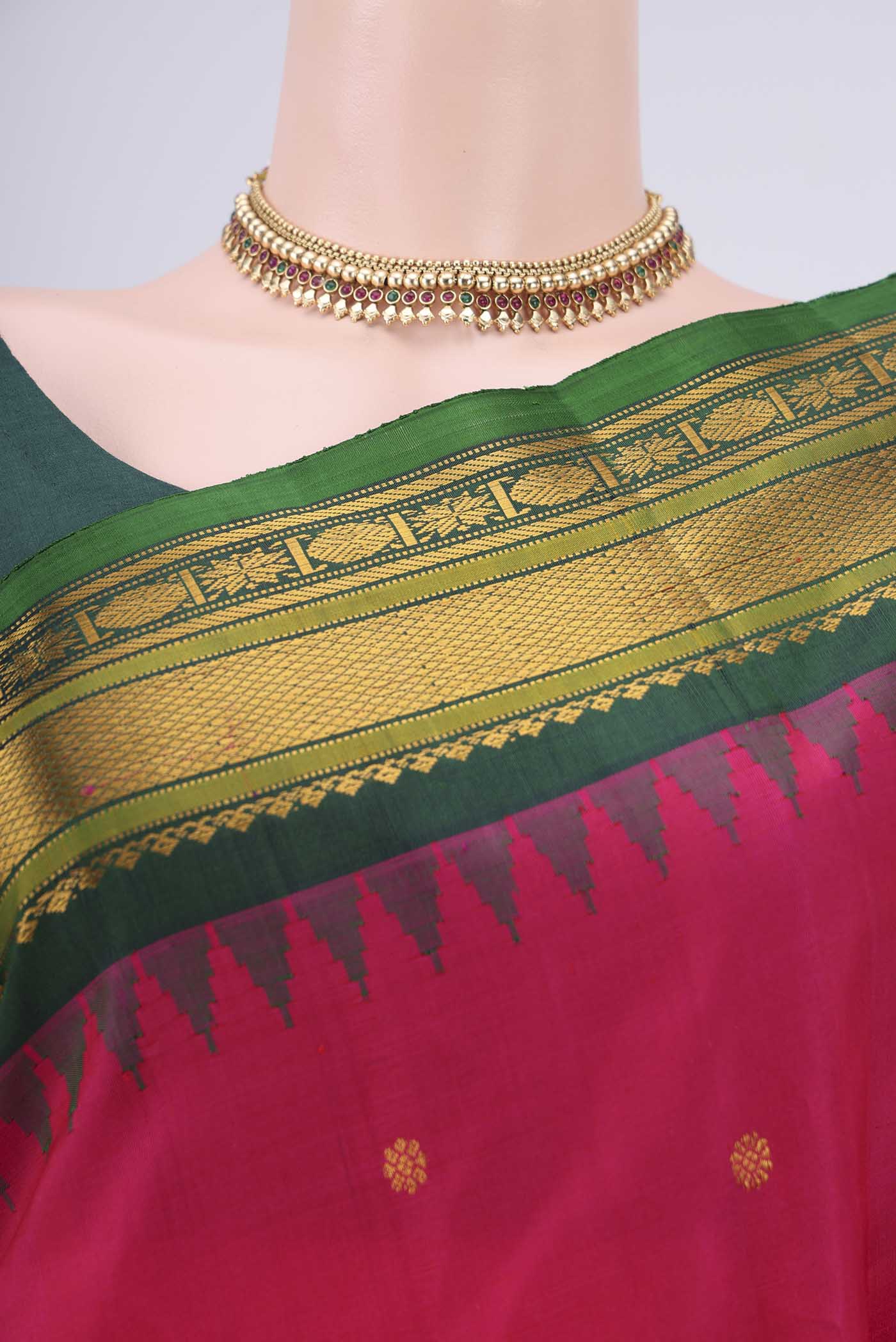 Border image of Rani Pink Gadwal Silk Saree with Zari Butta on the body and Zari Border. 