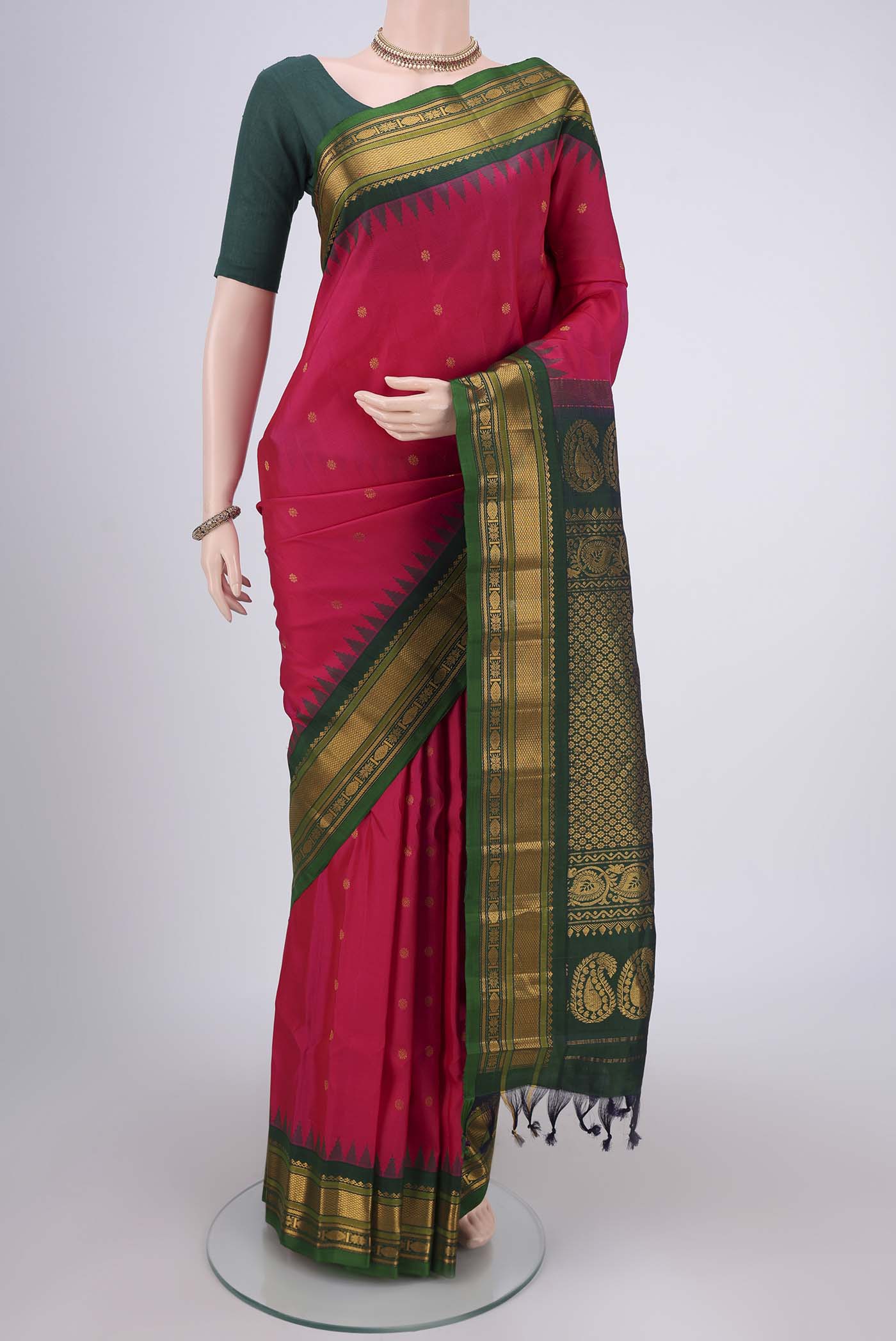 Rani Pink Gadwal Silk Saree with Zari Butta on the body and Zari Border.  displayed on a mannequin