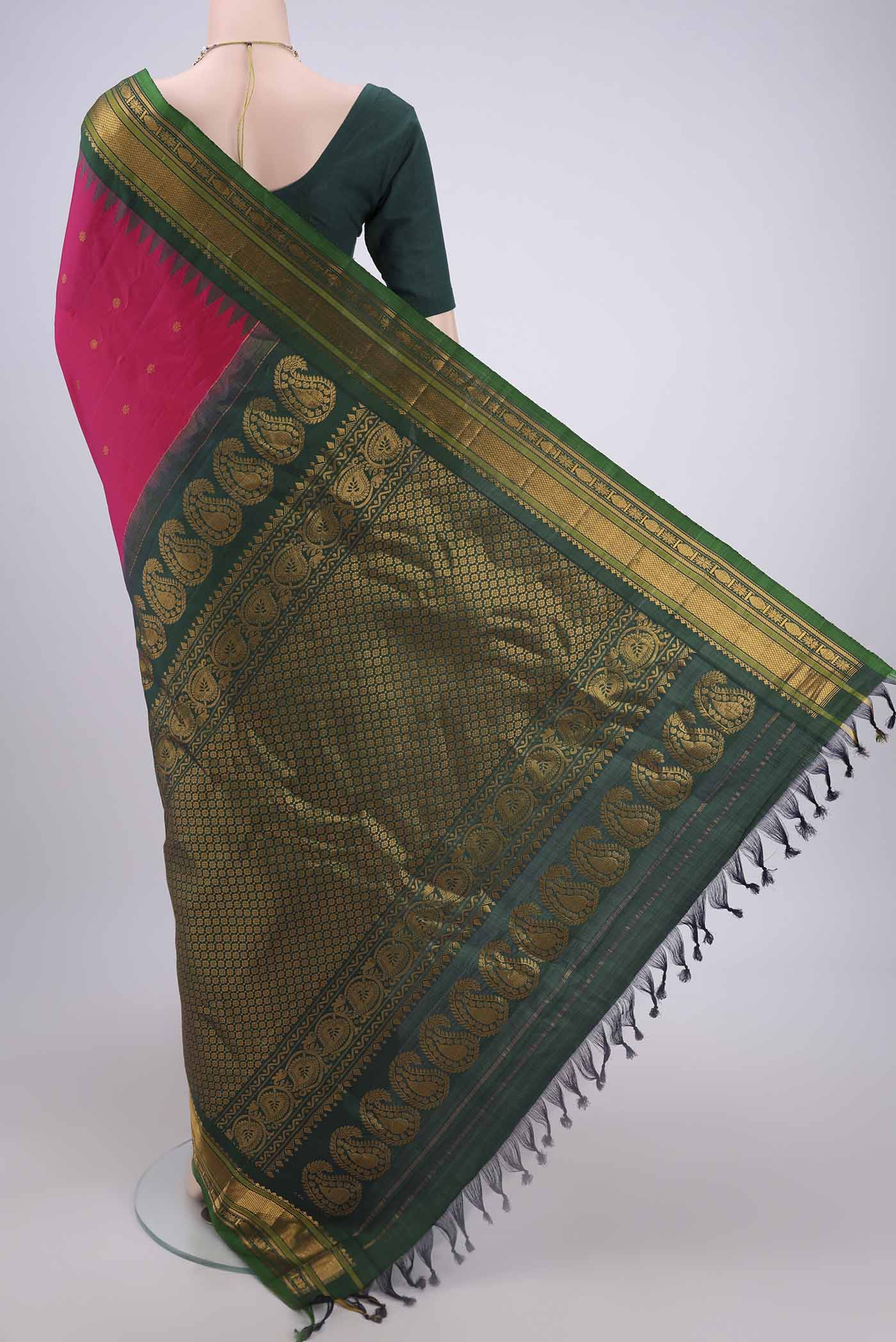Flat view of Rani Pink Gadwal Silk Saree with Zari Butta on the body and Zari Border. 