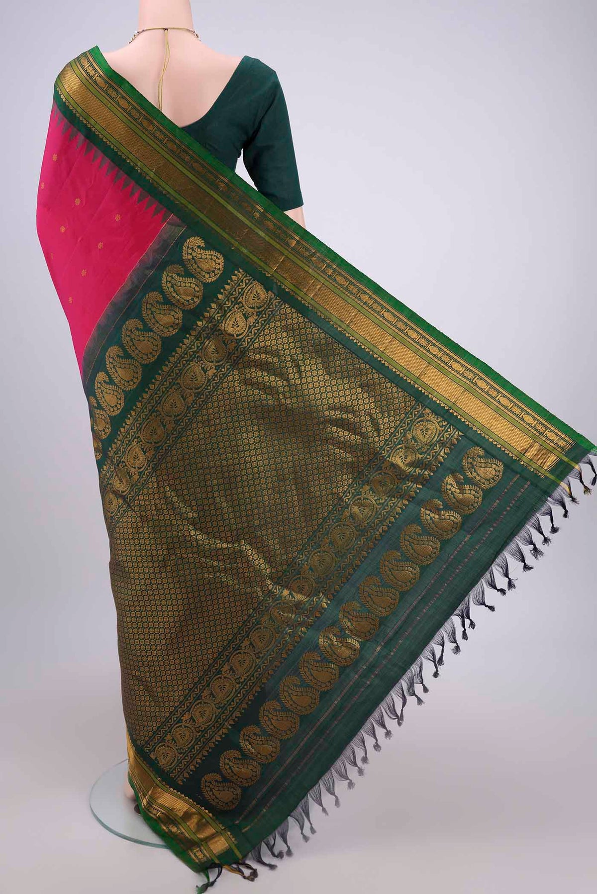 Flat view of Rani Pink Gadwal Silk Saree with Zari Butta on the body and Zari Border. 