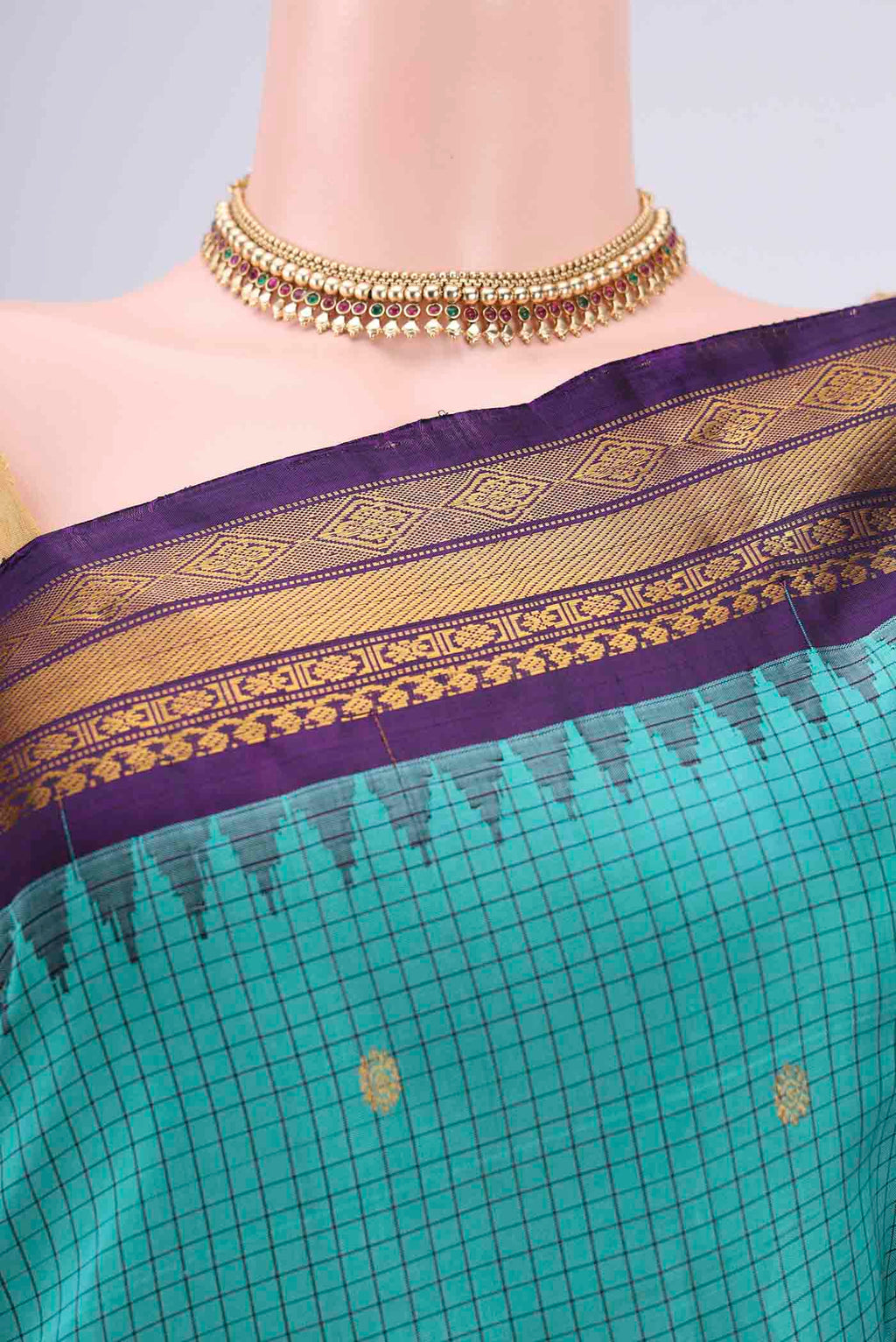 Border image of Turquoise Gadwal Silk Saree with Checked design on the body and Zari Border. 
