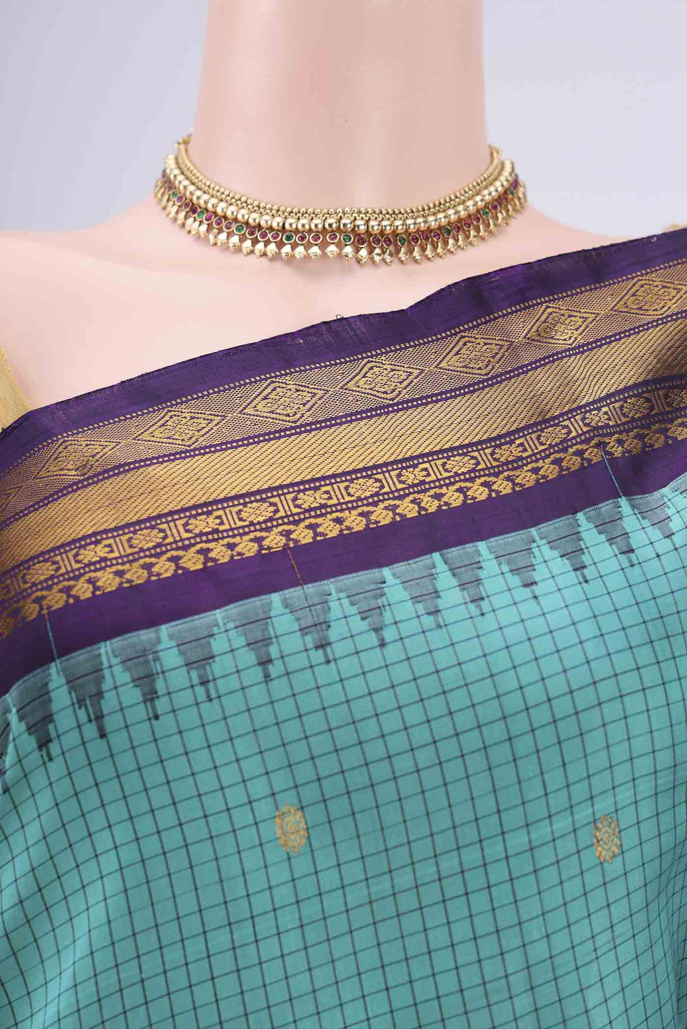 Border image of Turquoise Gadwal Silk Saree with Checked design on the body and Zari Border. 
