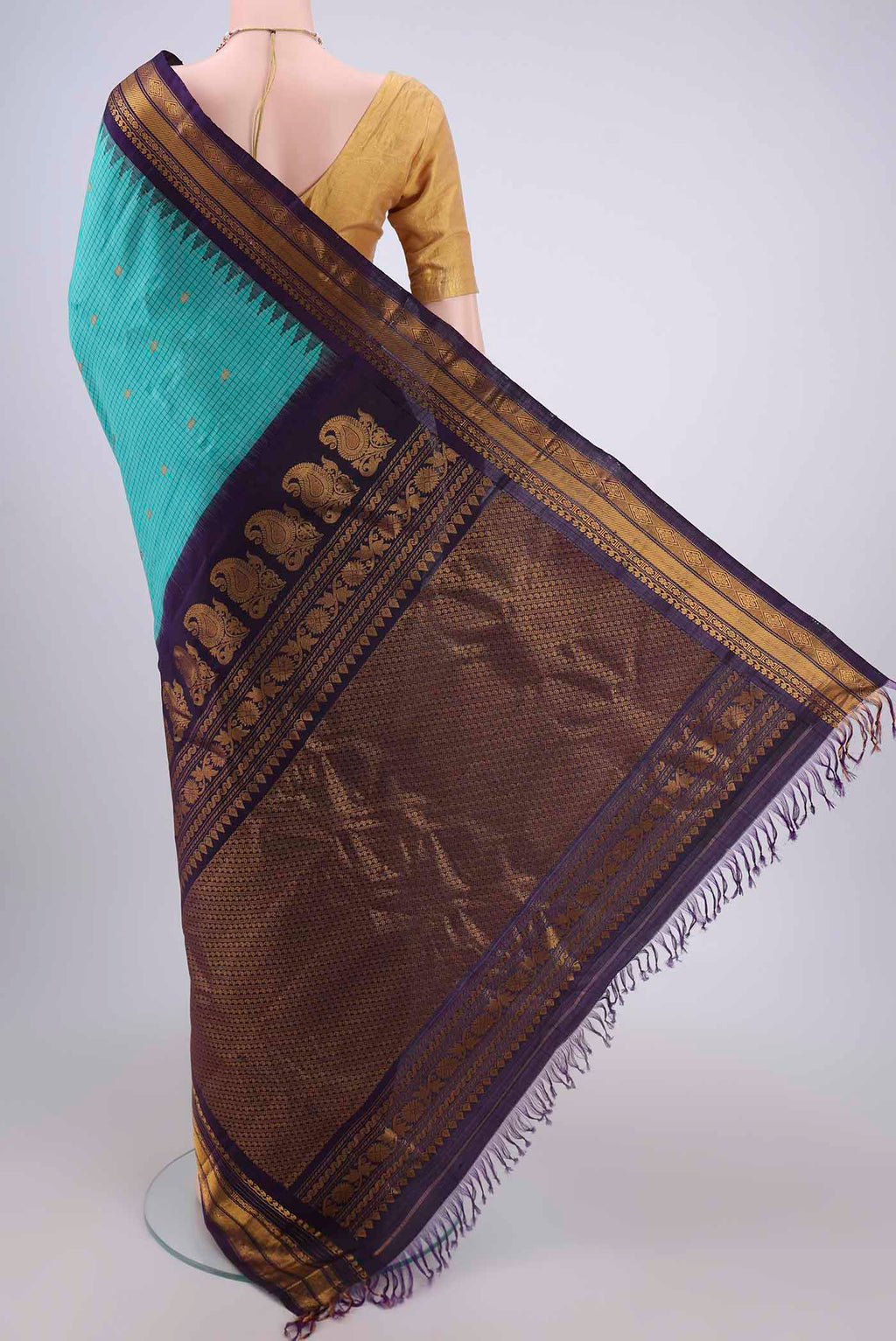 Flat view of Turquoise Gadwal Silk Saree with Checked design on the body and Zari Border. 