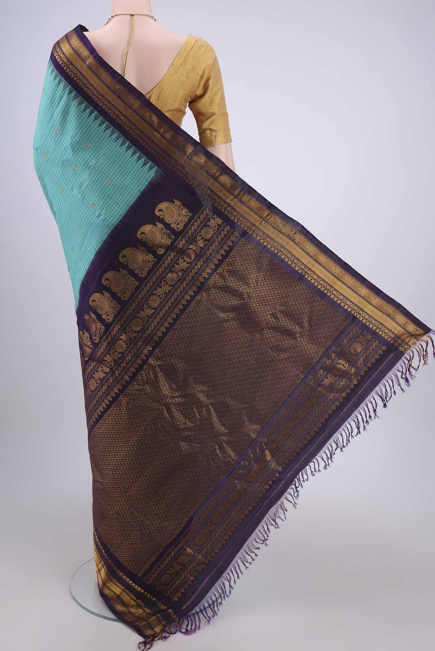 Flat view of Turquoise Gadwal Silk Saree with Checked design on the body and Zari Border. 
