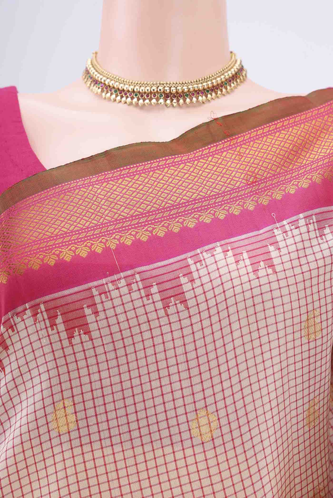 Border image of Off White Gadwal Silk Saree with Checked design on the body and Zari Border. 