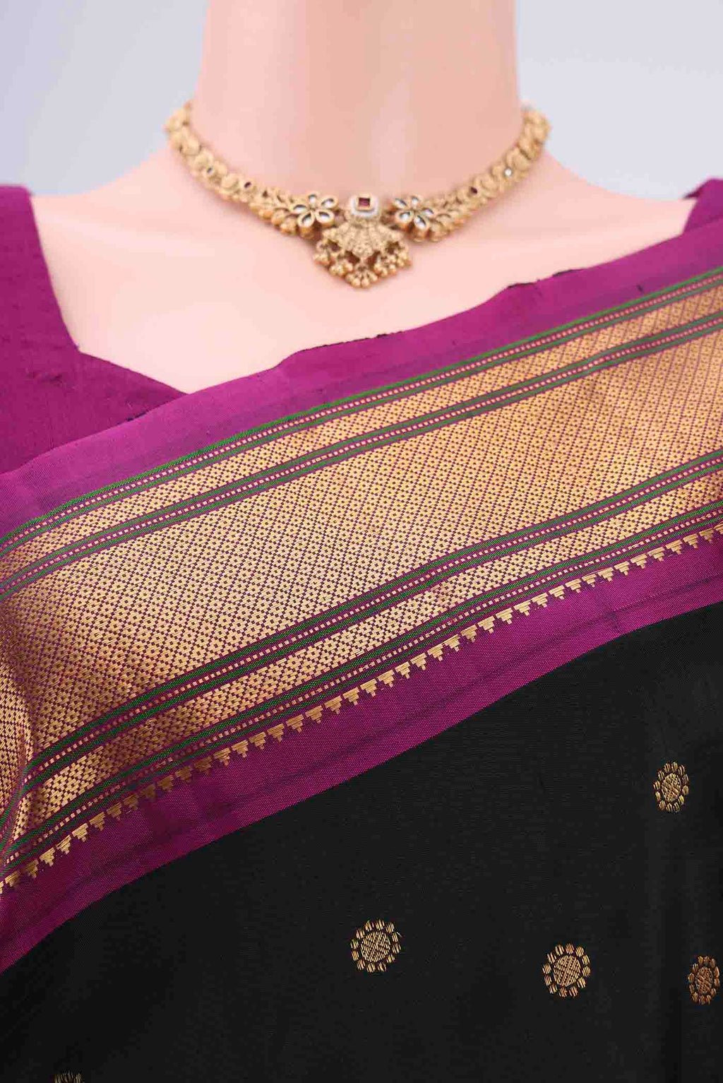 Border image of Black Gadwal Silk Saree with Zari Butta on the body and Zari Border. 