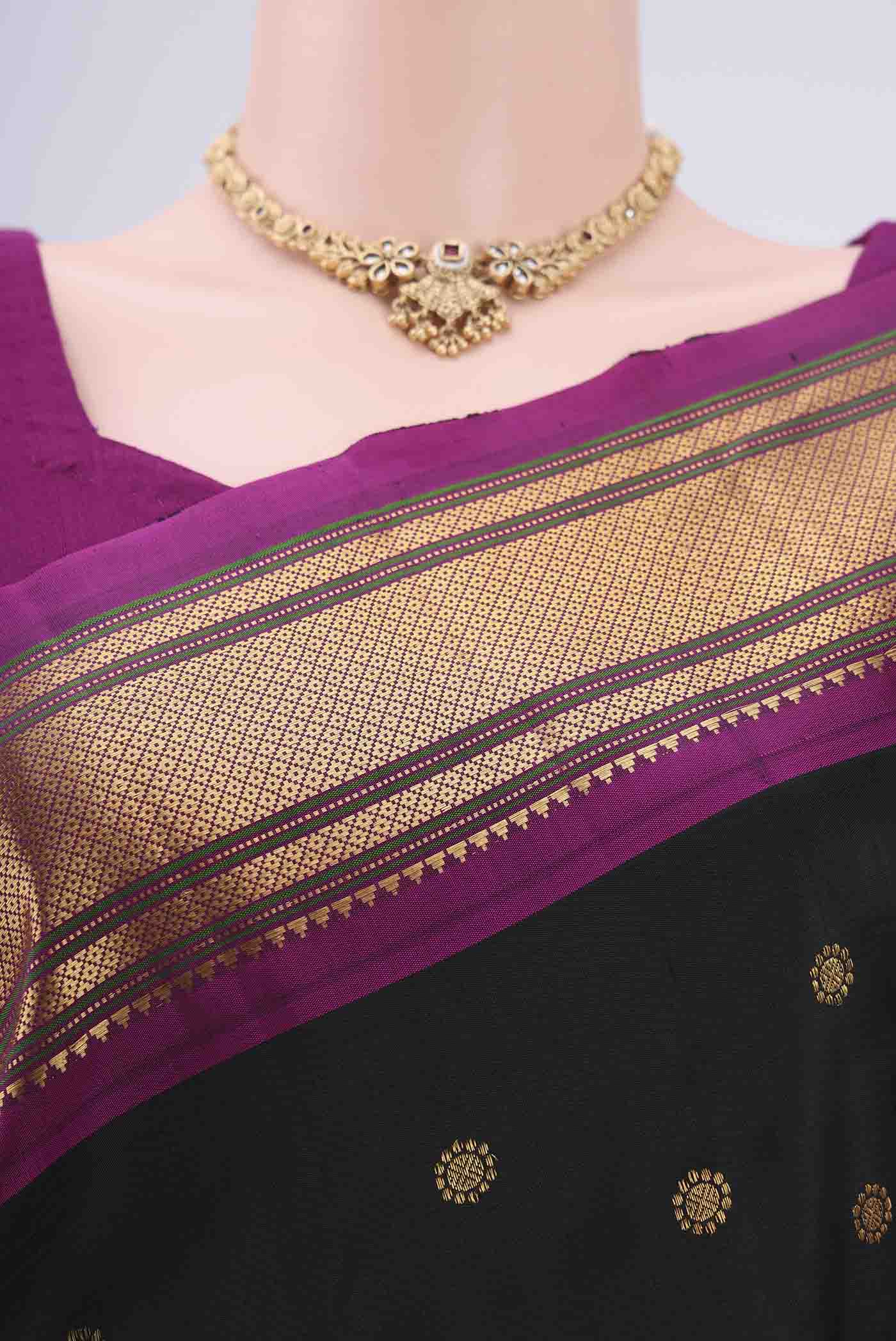 Border image of Black Gadwal Silk Saree with Zari Butta on the body and Zari Border. 