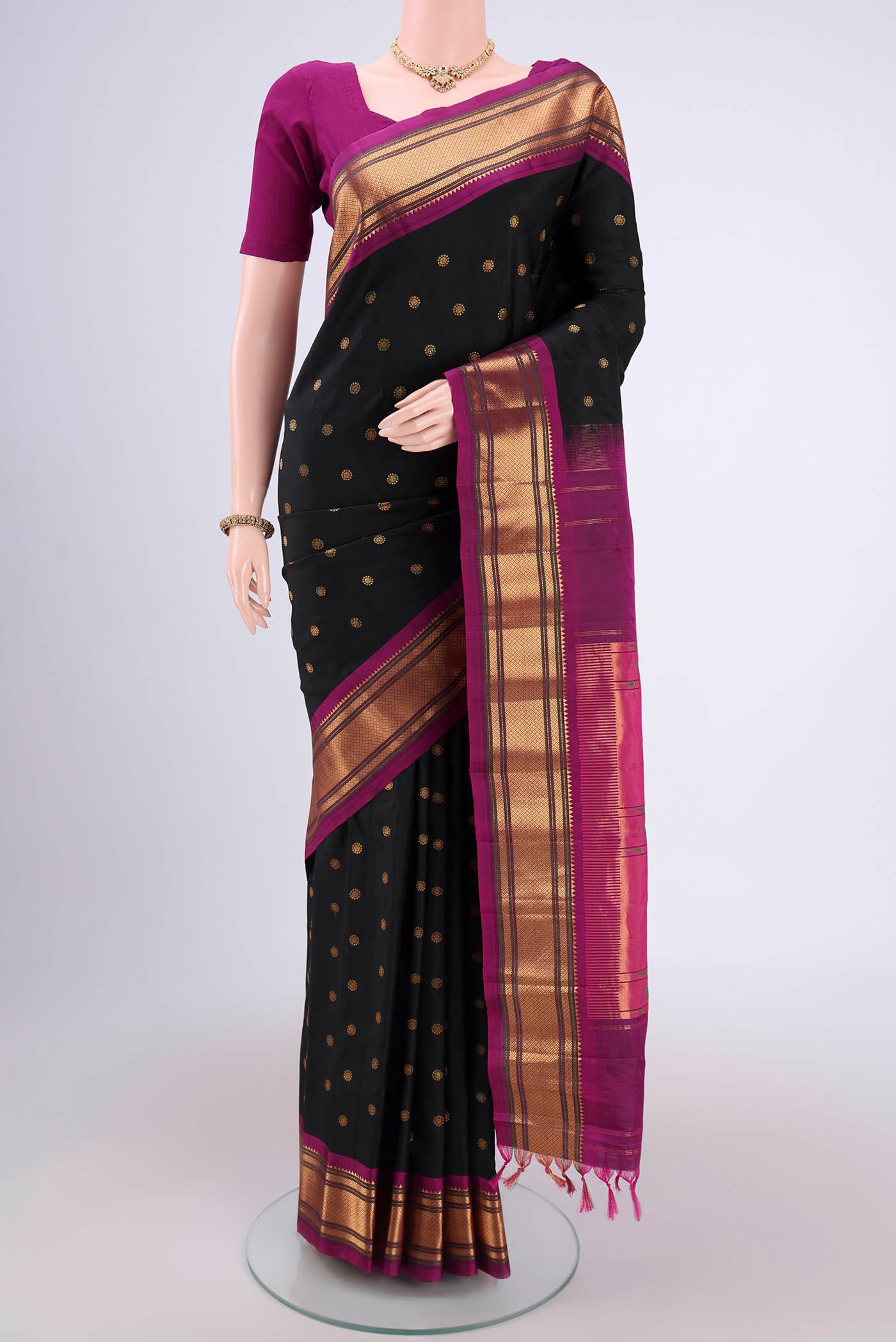 Black Gadwal Silk Saree with Zari Butta on the body and Zari Border.  displayed on a mannequin