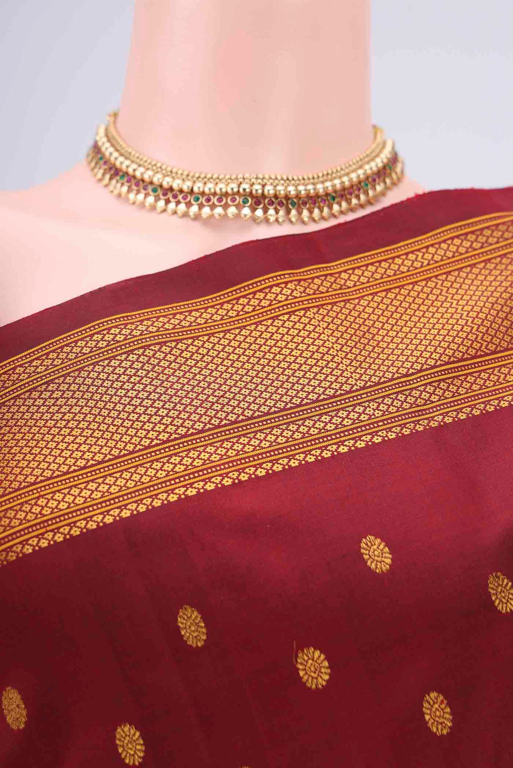 Border image of Maroon Gadwal Silk Saree with Zari Butta on the body and Zari Border. 