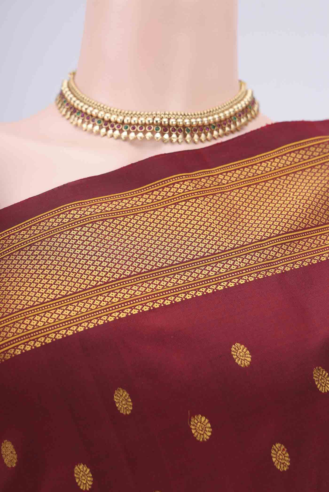 Border image of Maroon Gadwal Silk Saree with Zari Butta on the body and Zari Border. 