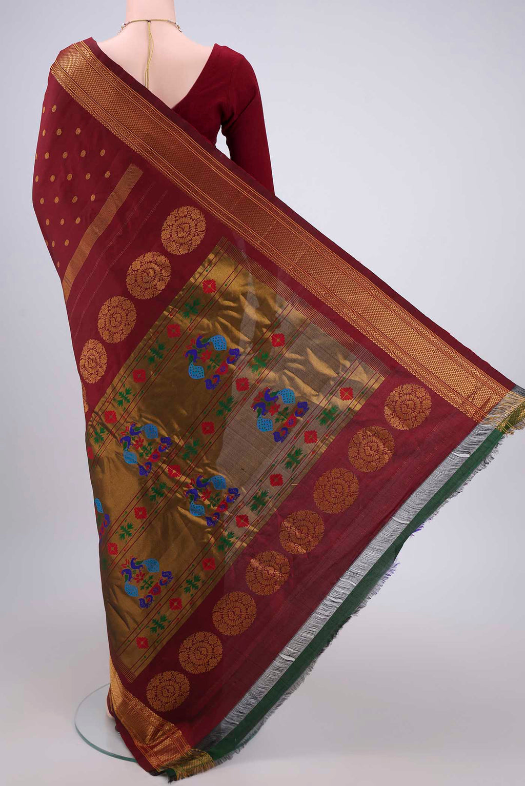 Flat view of Maroon Gadwal Silk Saree with Zari Butta on the body and Zari Border. 