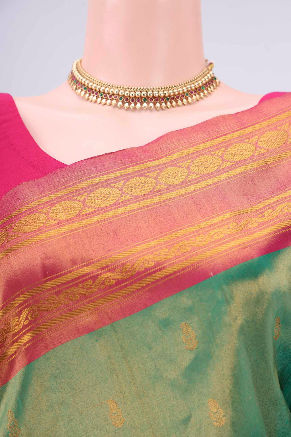 Border image of Green Gadwal Silk Saree with Zari Butta on the body and Zari Border. 
