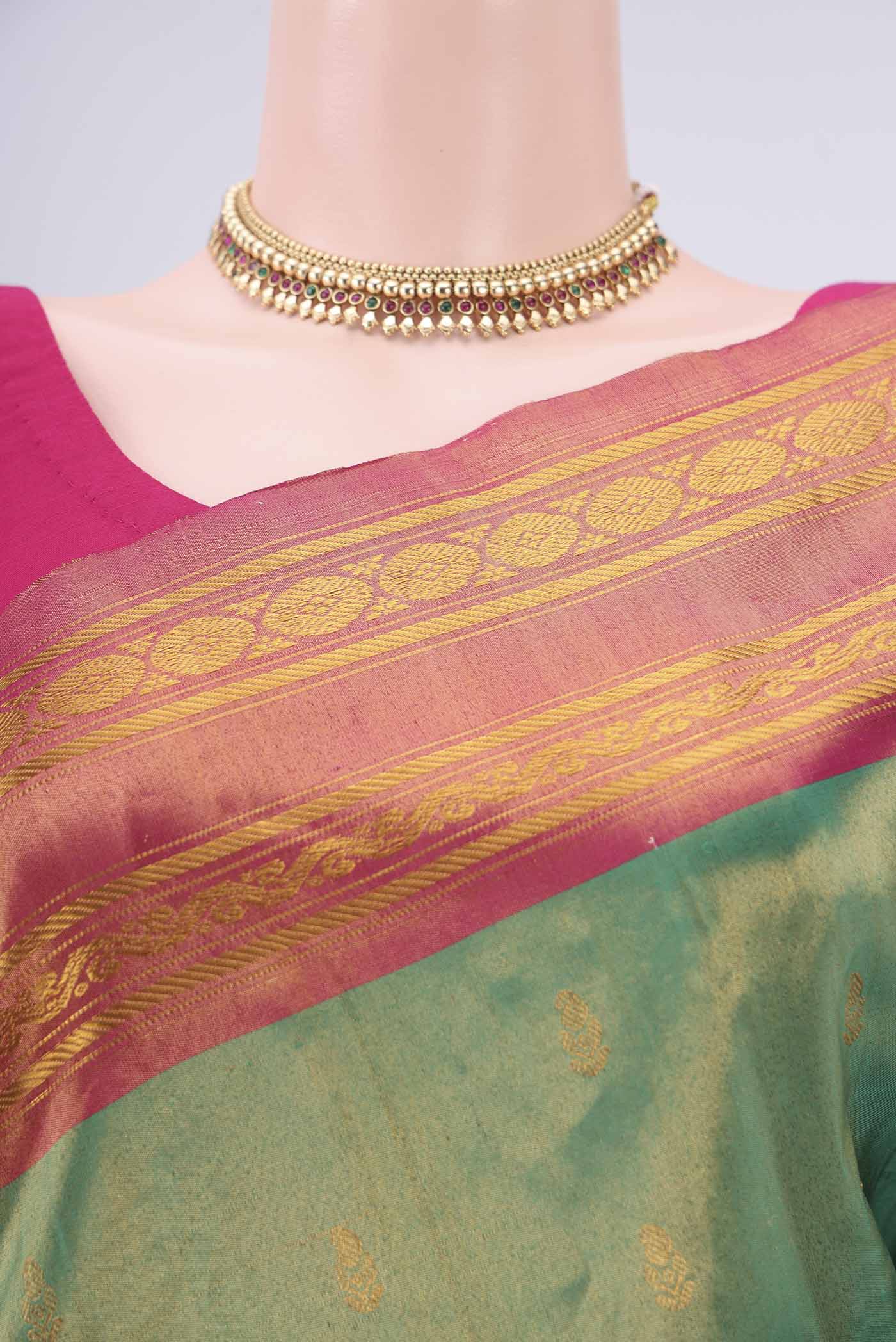 Border image of Green Gadwal Silk Saree with Zari Butta on the body and Zari Border. 