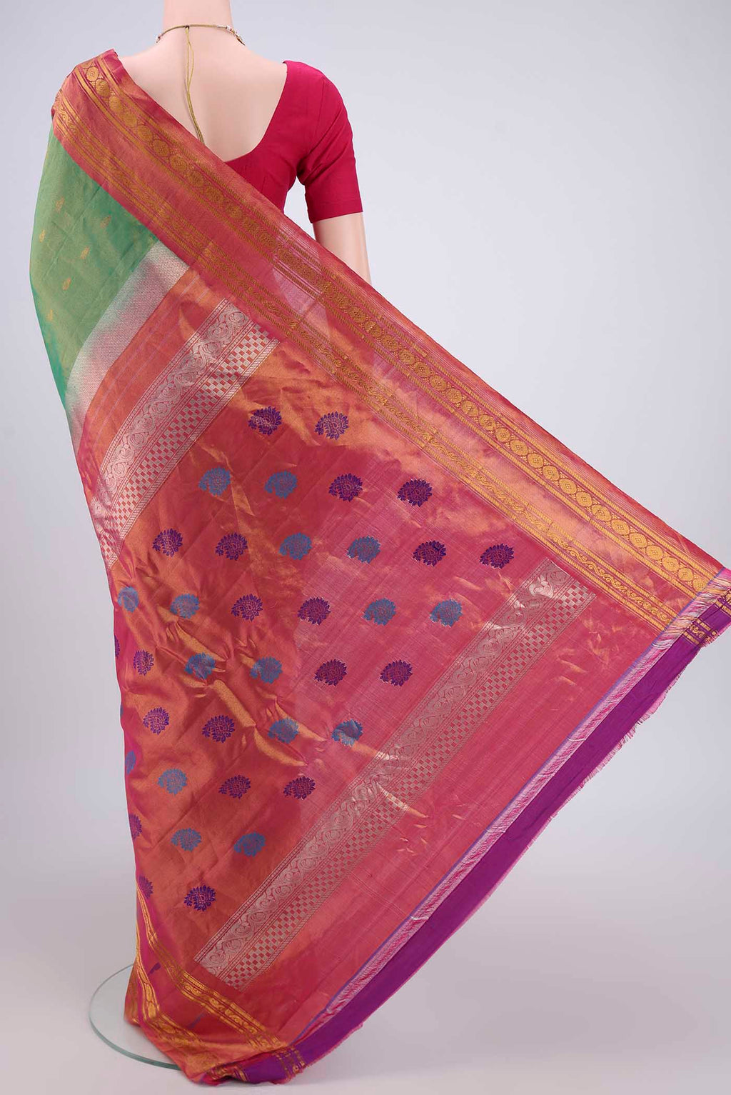 Flat view of Green Gadwal Silk Saree with Zari Butta on the body and Zari Border. 