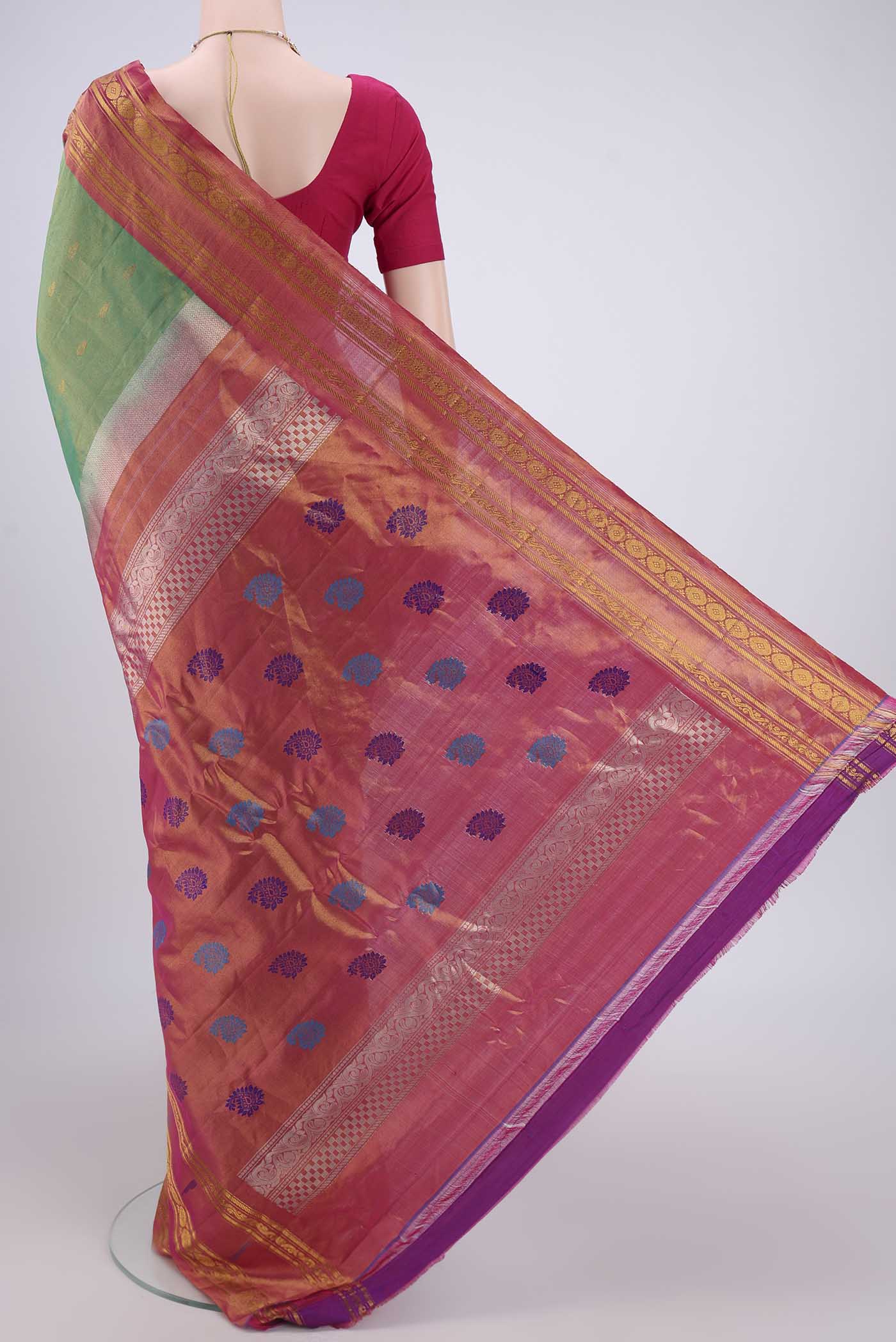 Flat view of Green Gadwal Silk Saree with Zari Butta on the body and Zari Border. 