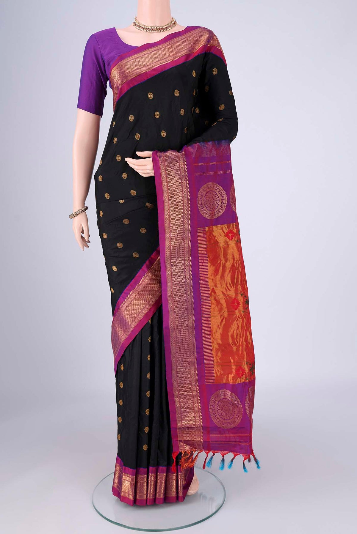 Black Gadwal Silk Saree with Zari Butta on the body and Zari Border.  displayed on a mannequin
