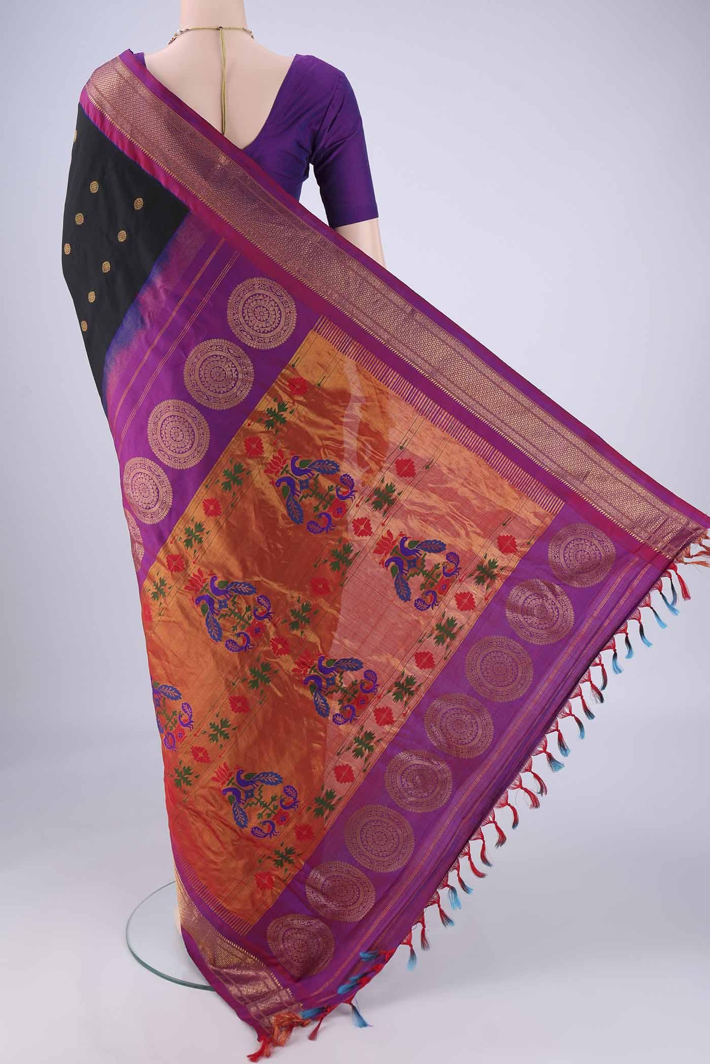 Flat view of Black Gadwal Silk Saree with Zari Butta on the body and Zari Border. 