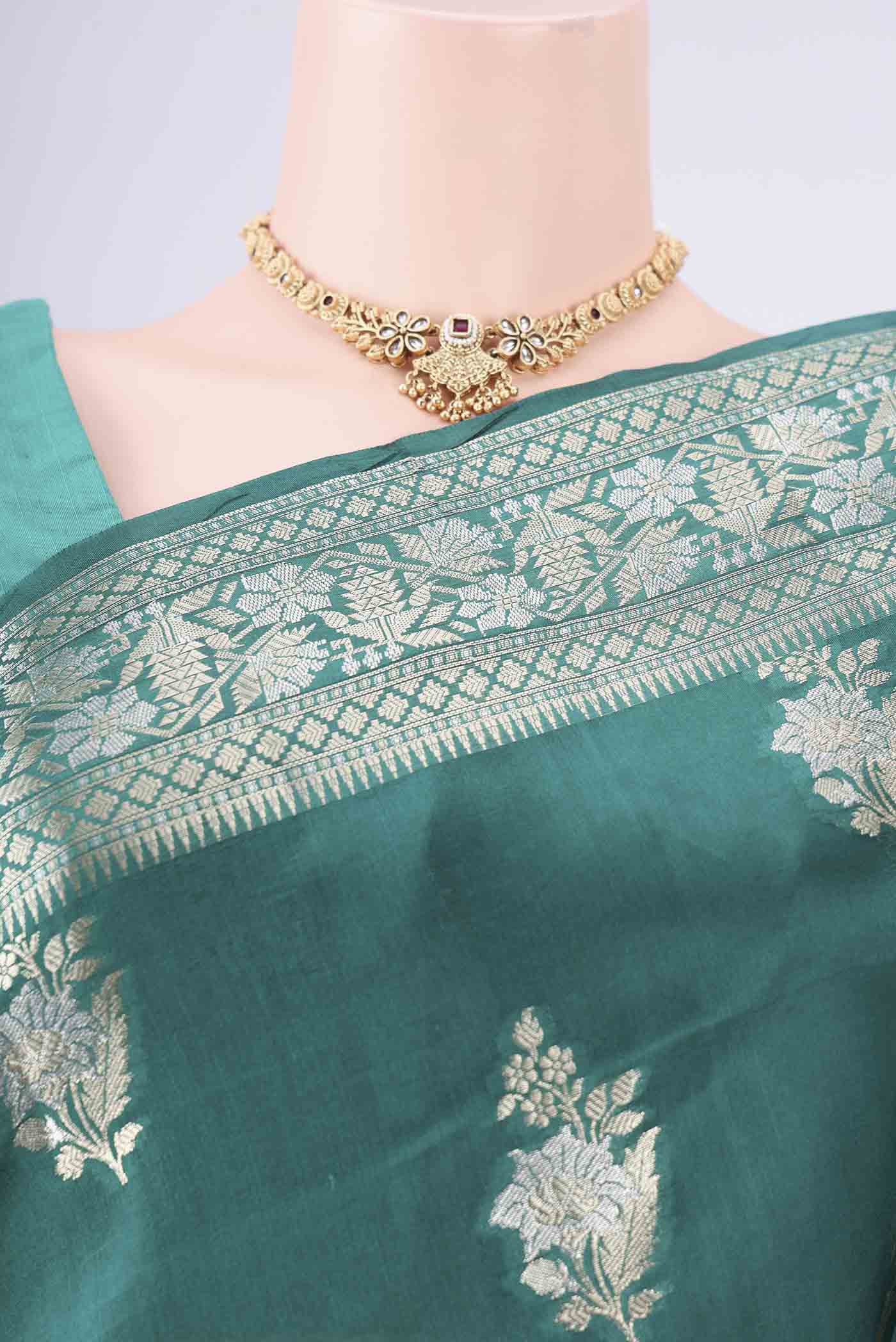 Border image of Bottle Green Banarasi Raw Silk Saree with Zari Butta on the body and Zari Border. 