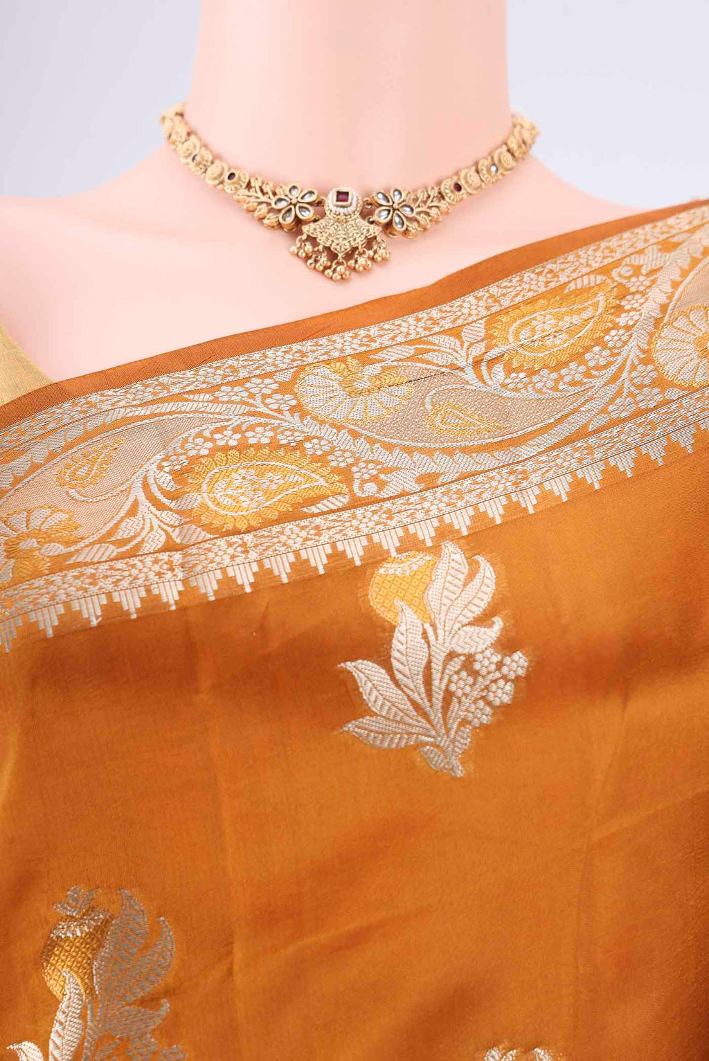 Border image of Caramel Banarasi Raw Silk Saree with Zari Butta on the body and Zari Border. 