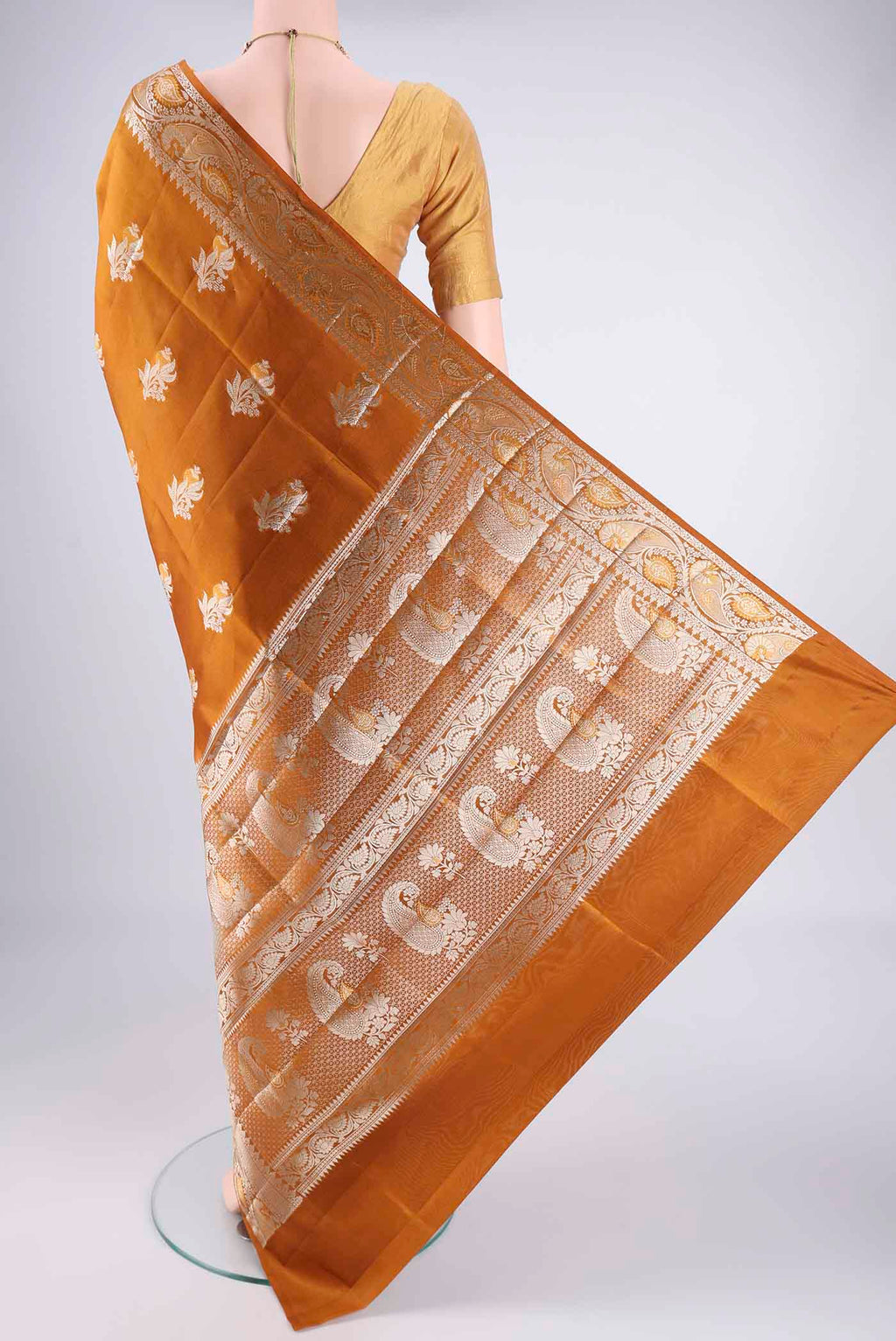 Flat view of Caramel Banarasi Raw Silk Saree with Zari Butta on the body and Zari Border. 