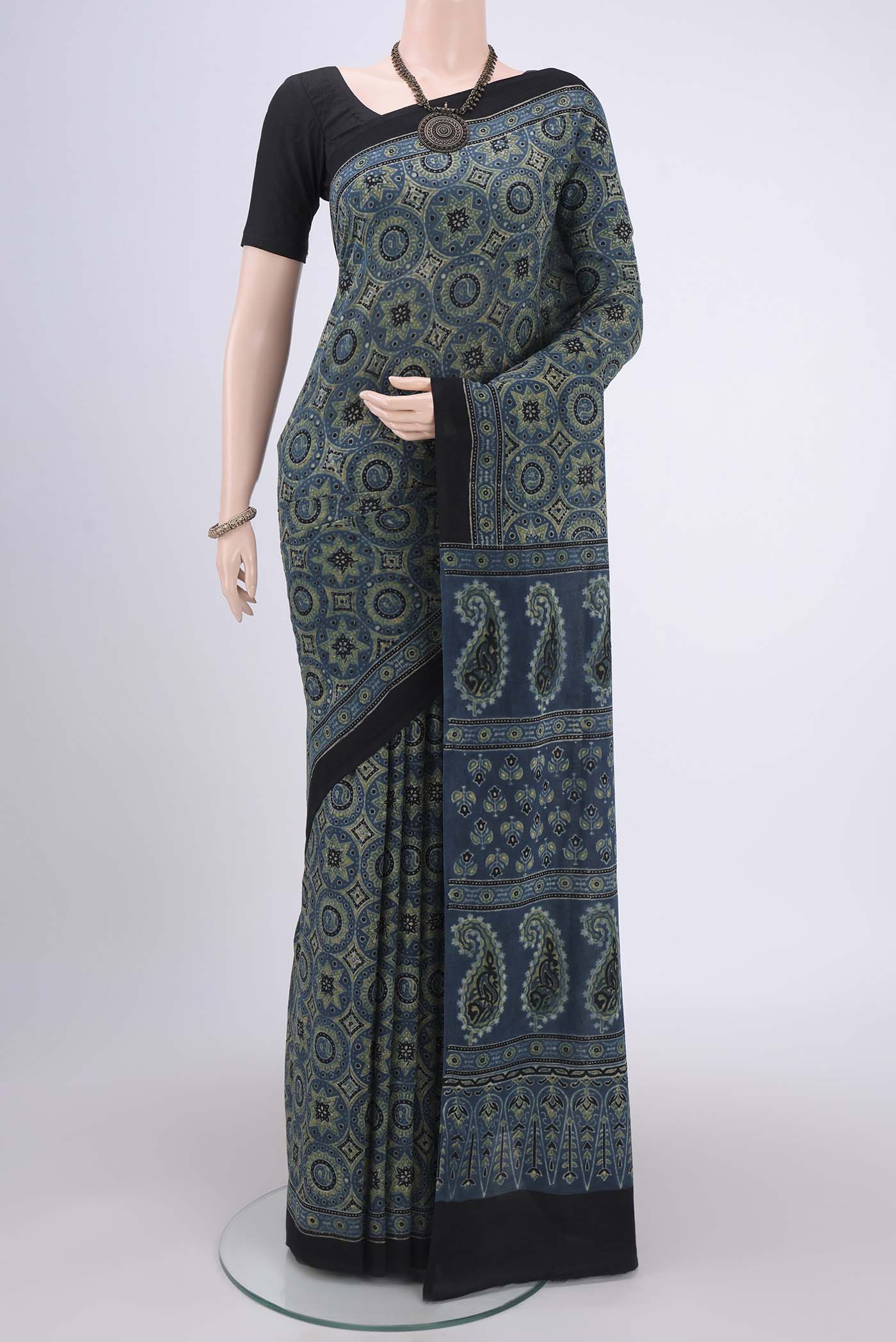 Dark Blue Maheshwari Silk Cotton Saree with Ajrakh Print on the body and Plain Border.  displayed on a mannequin