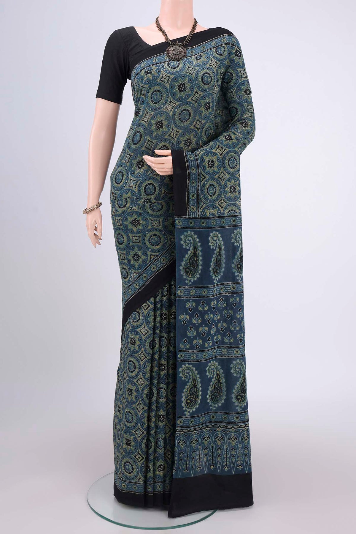 Dark Blue Maheshwari Silk Cotton Saree with Ajrakh Print on the body and Plain Border.  displayed on a mannequin