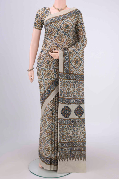 Beige Maheshwari Silk Cotton Saree with Ajrakh Print on the body and Plain Border.  displayed on a mannequin