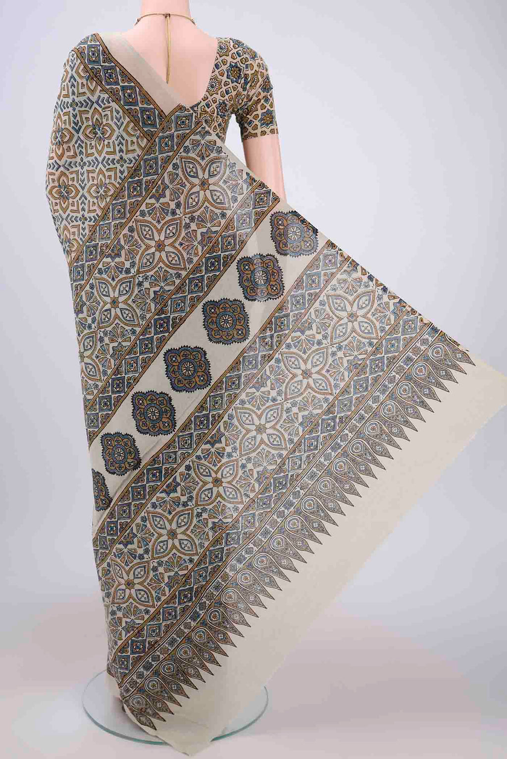 Flat view of Beige Maheshwari Silk Cotton Saree with Ajrakh Print on the body and Plain Border. 
