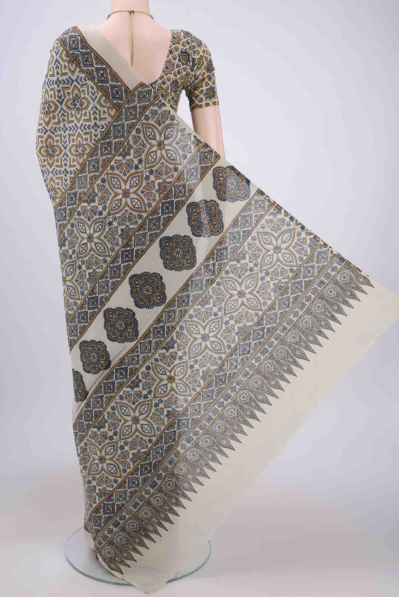 Flat view of Beige Maheshwari Silk Cotton Saree with Ajrakh Print on the body and Plain Border. 